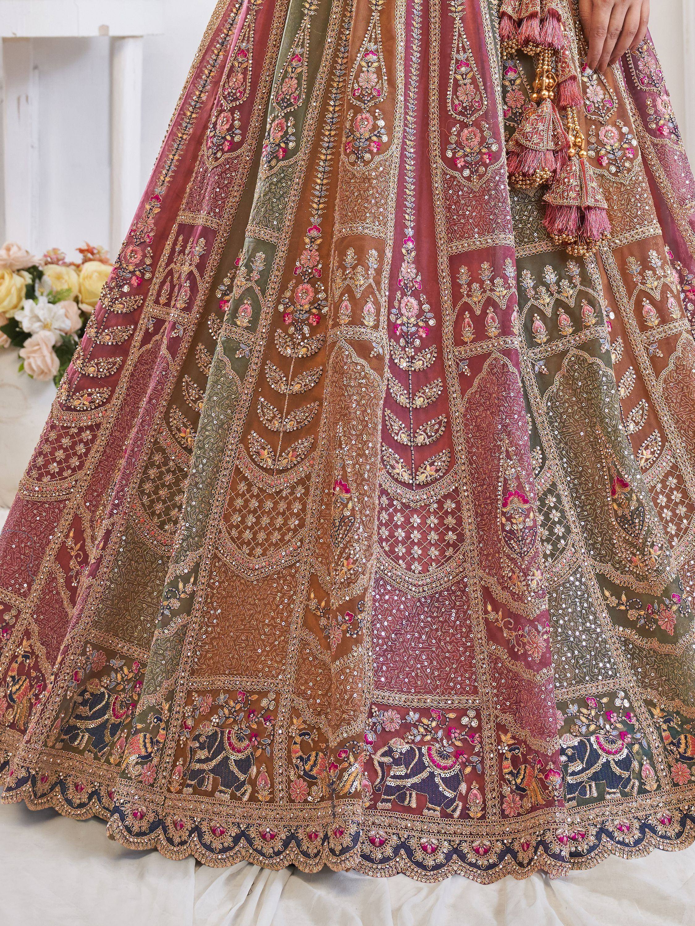 Luxury embroidered lehenga choli with floral and elephant motifs, perfect for Indian weddings and festive occasions.