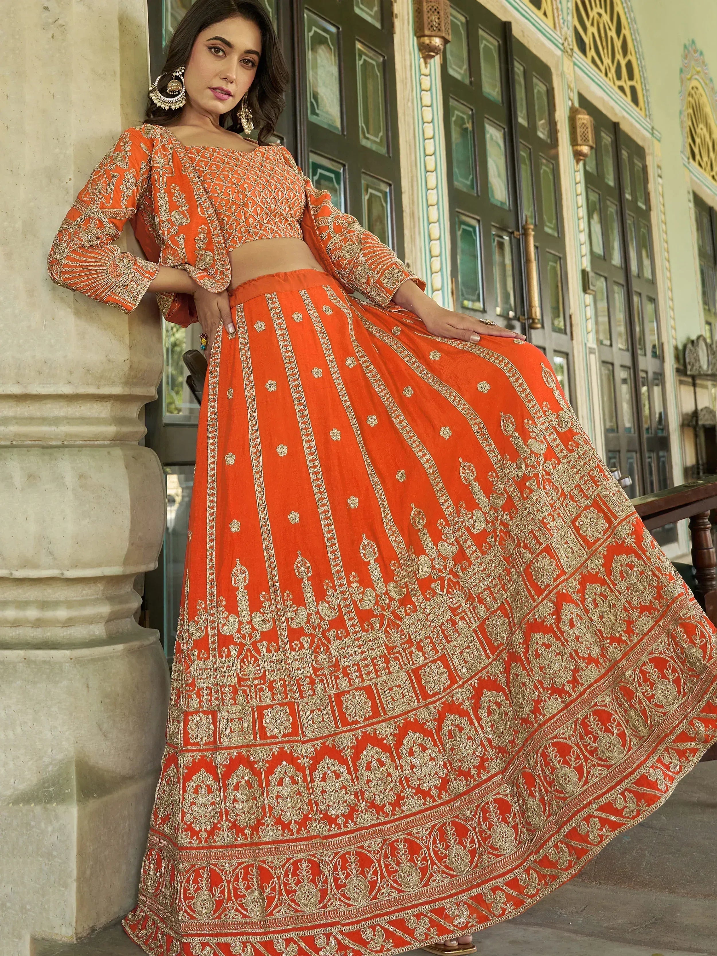 Orange embroidered lehenga choli with gold detailing, perfect for Indian ethnic wear occasions