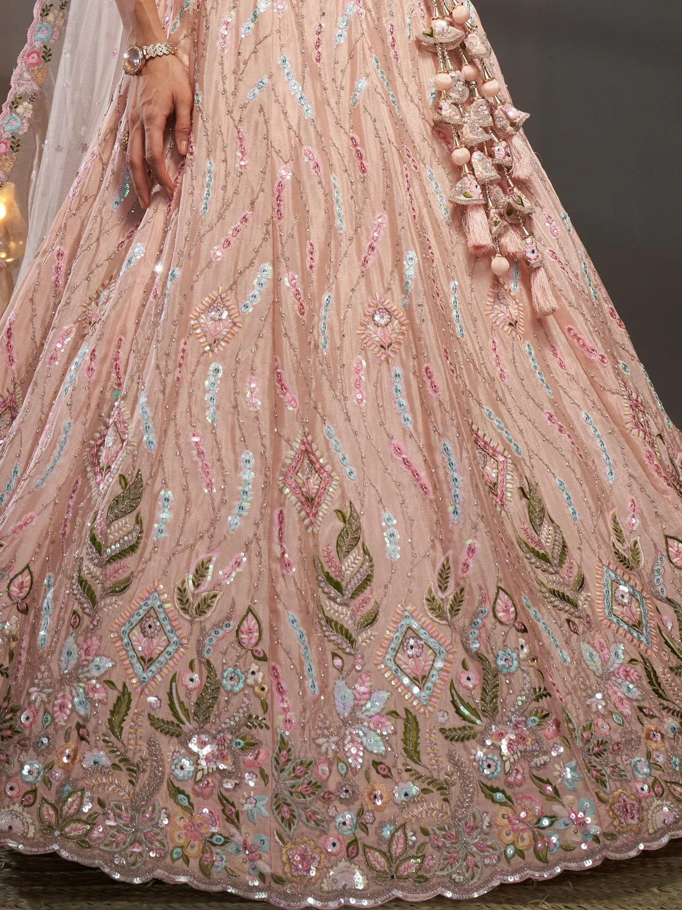 Pink designer lehenga with floral embroidery, sequins, and tassels for Indian ethnic wear