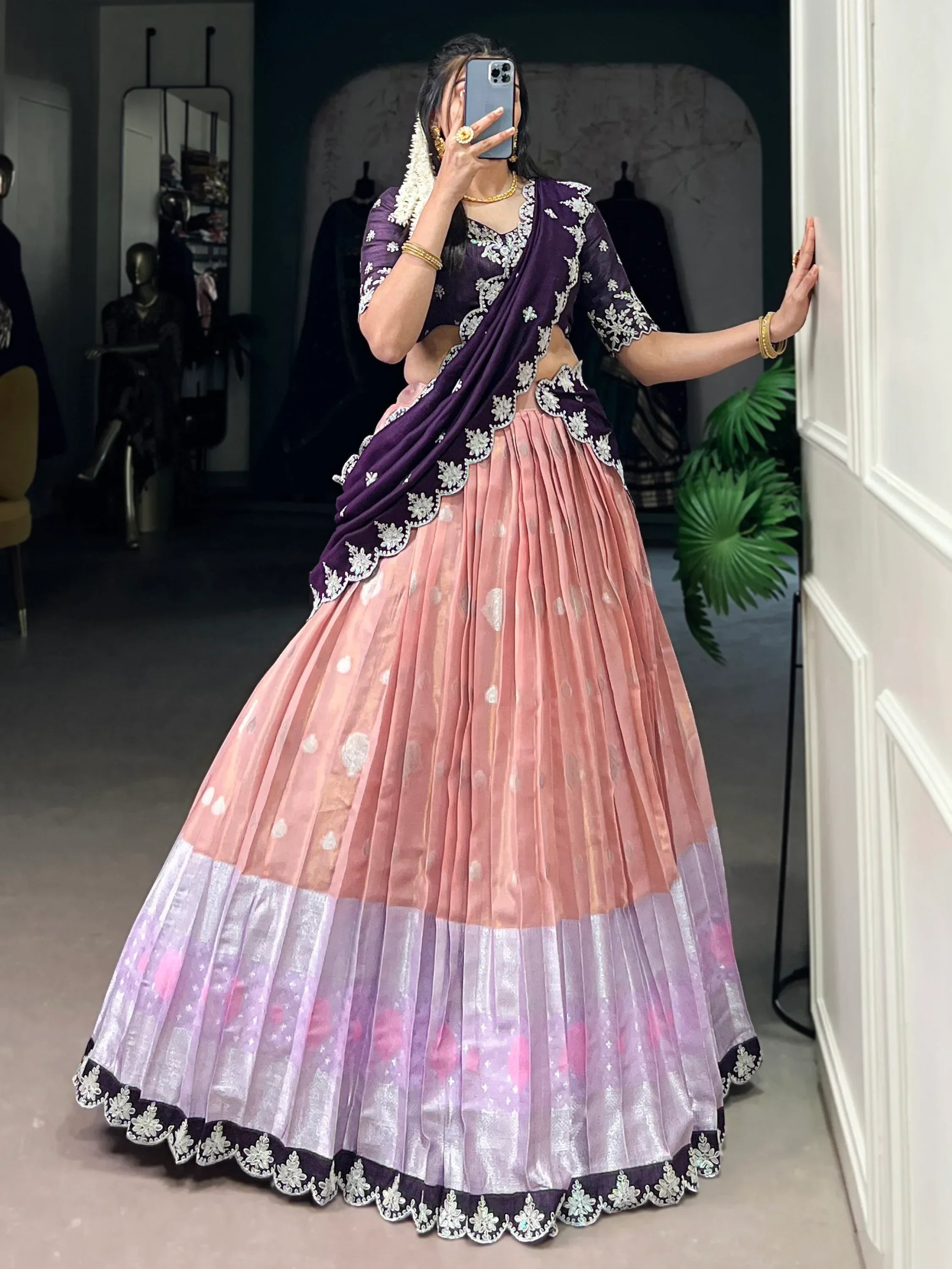 Elegant purple and pink lehenga choli with floral embroidery, perfect for Indian ethnic wear.