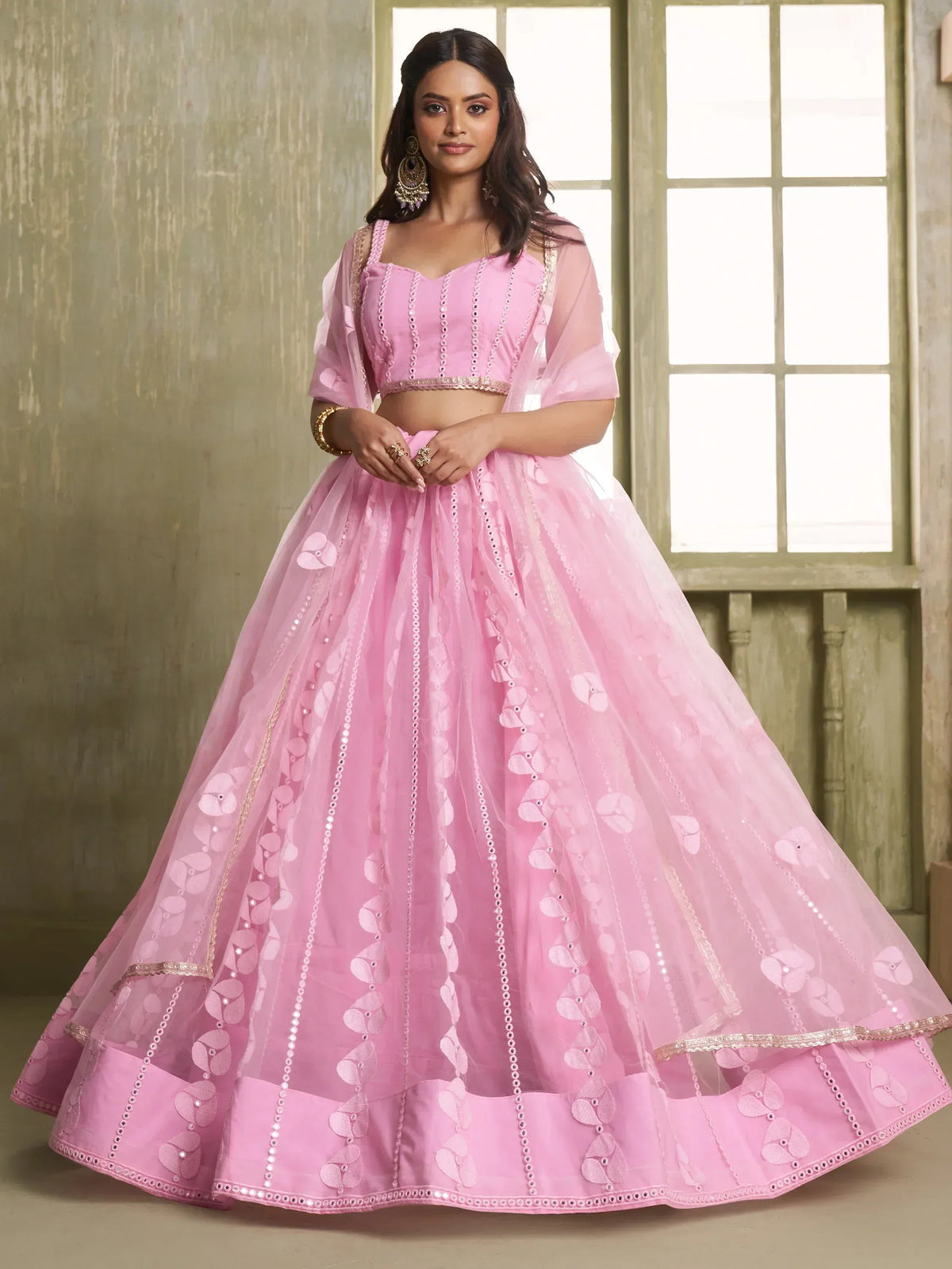 Pink designer lehenga choli with floral embroidery and sheer dupatta for Indian ethnic wear