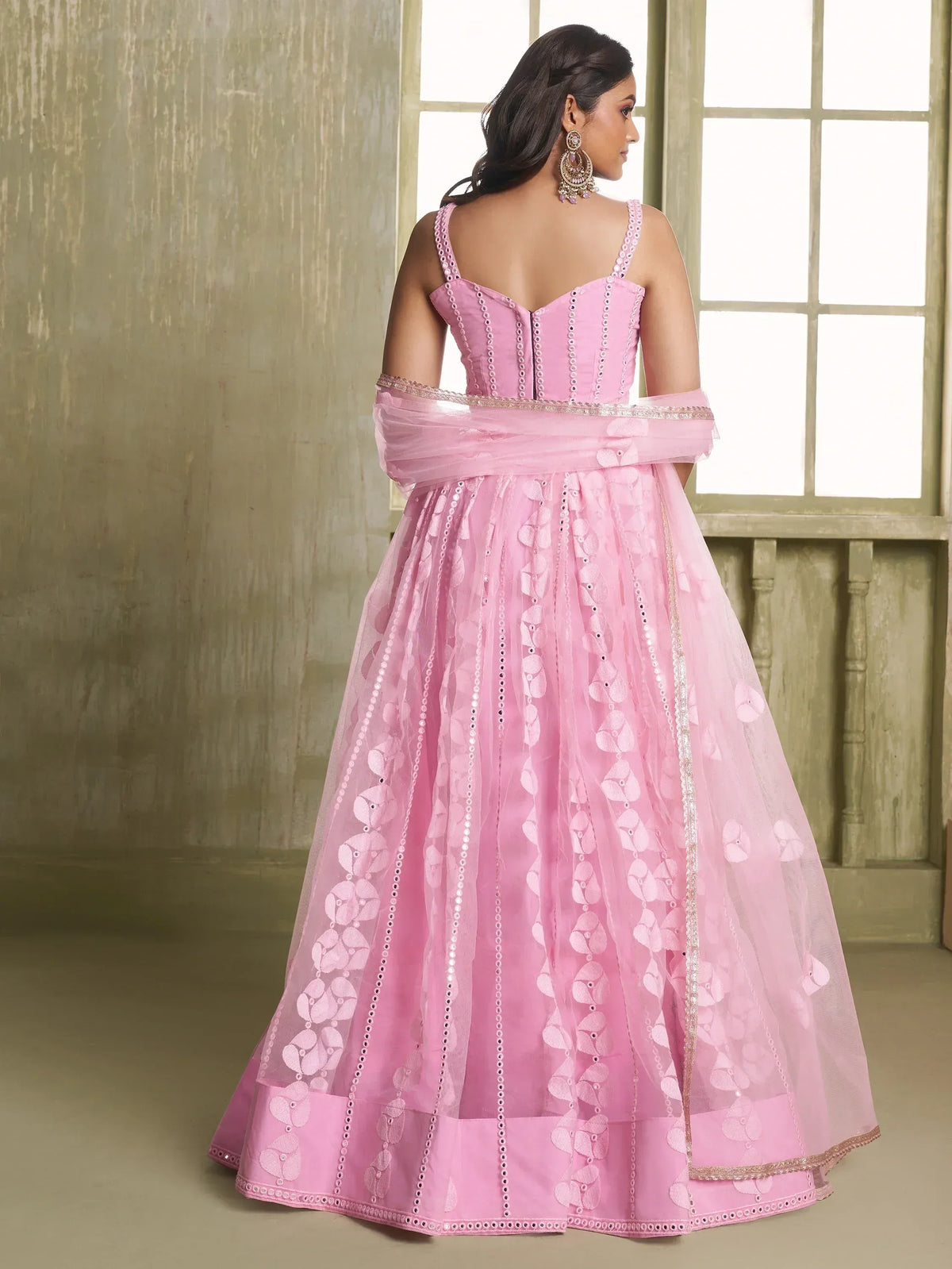Pink designer lehenga choli with floral embroidery and sequin detailing, perfect for Indian ethnic occasions.