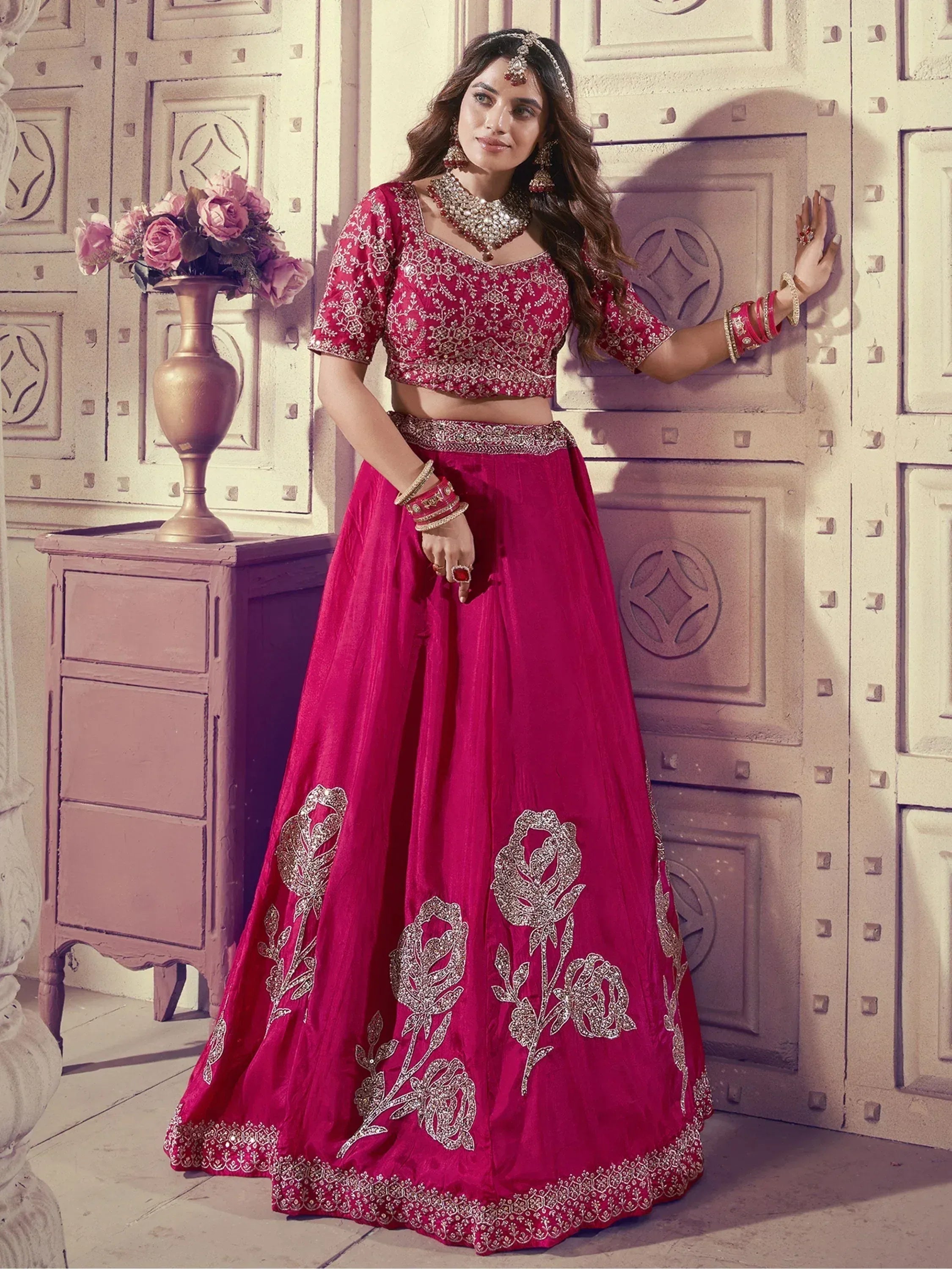 Red embroidered lehenga choli with floral motifs, perfect for Indian weddings and festive occasions