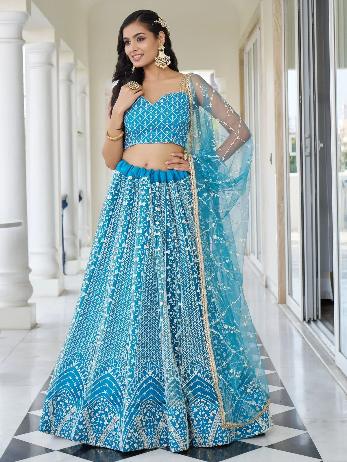 Blue embroidered lehenga choli with sheer dupatta, perfect for Indian ethnic wear events