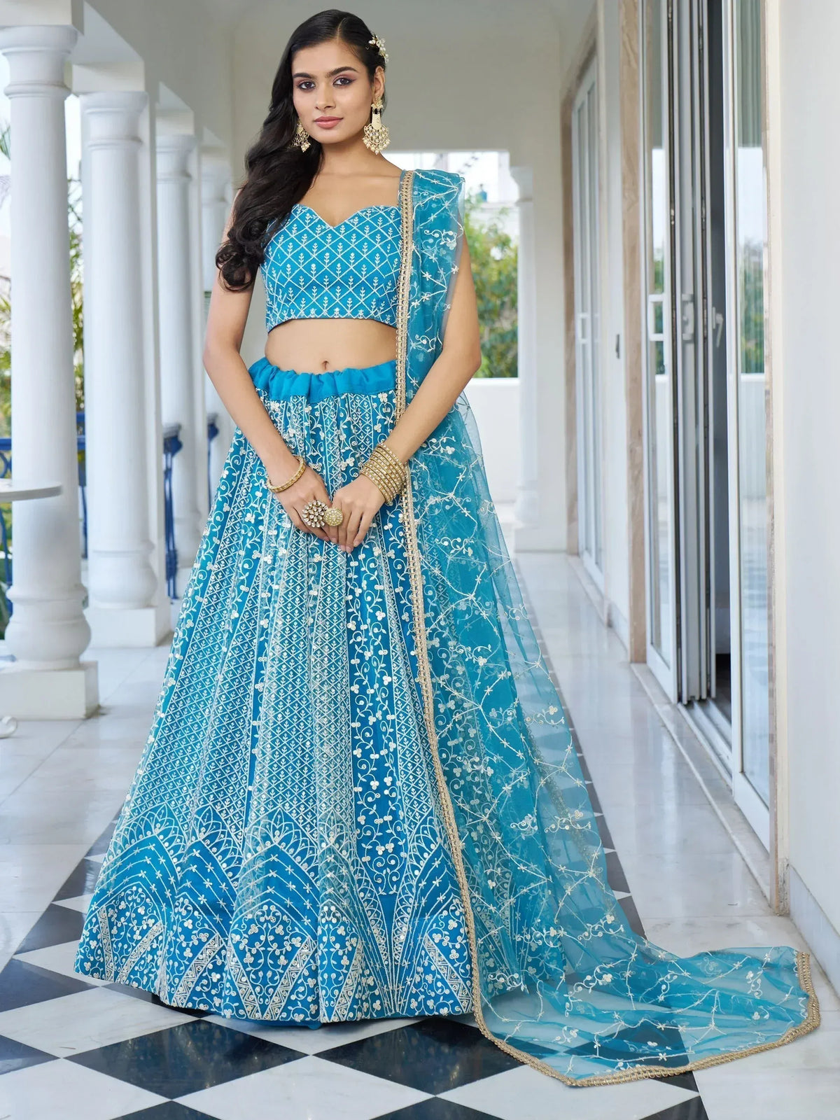 Blue embroidered lehenga choli with gold detailing, perfect for Indian ethnic wear occasions
