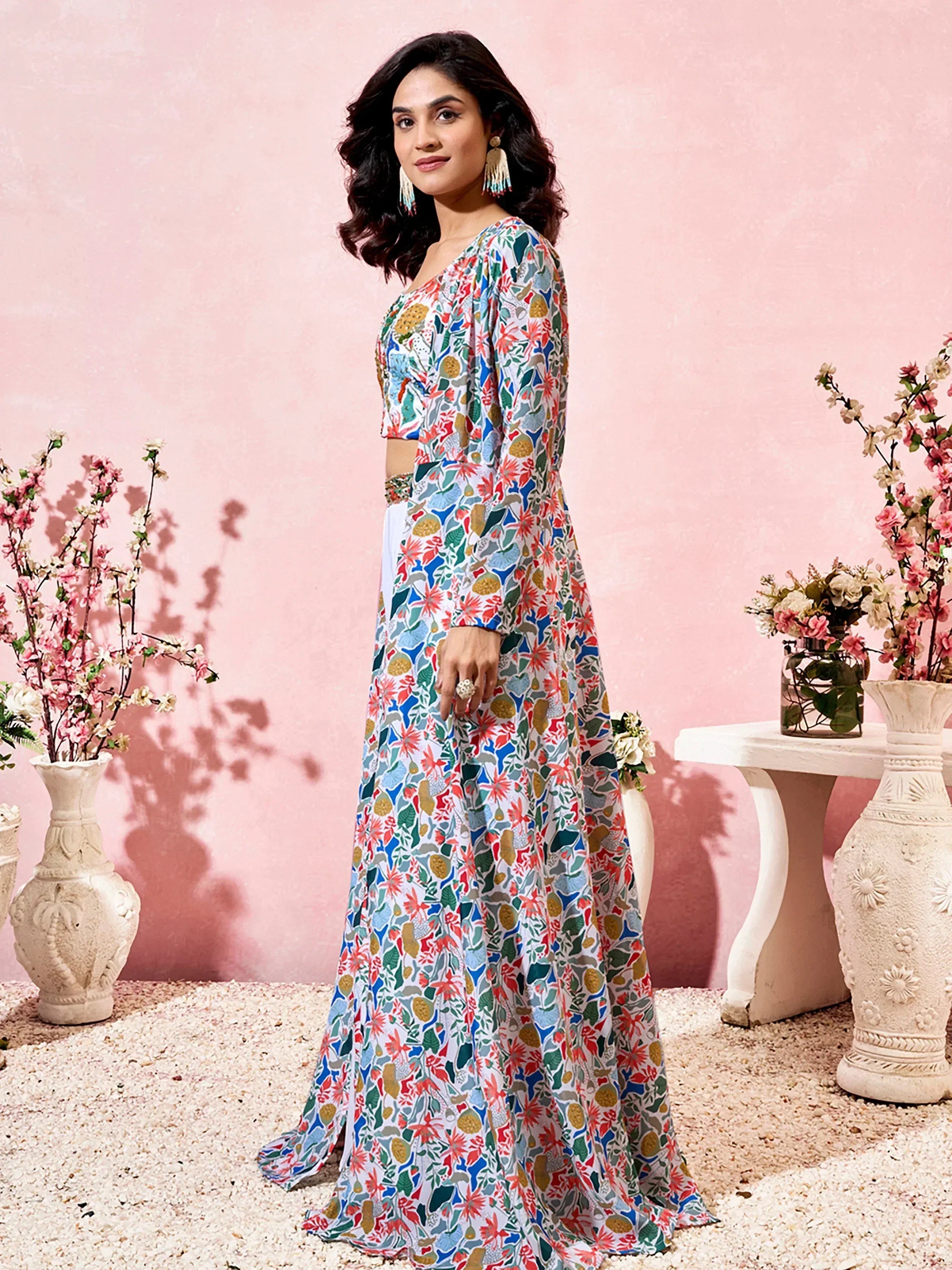 Woman in colorful floral print ethnic gown with long sleeves, perfect for Indian occasions