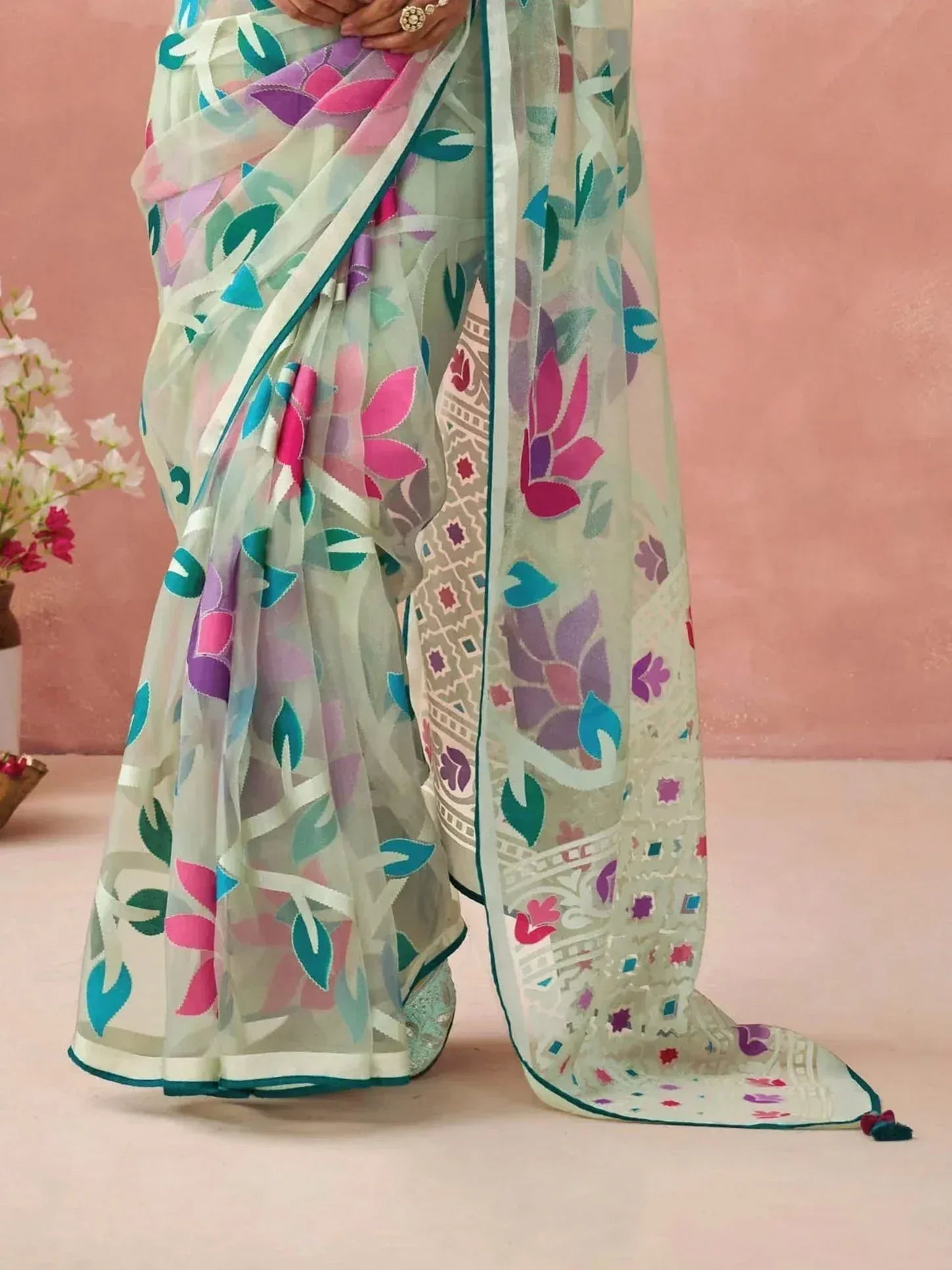Floral print saree with pastel hues and ethnic border, perfect for Indian ethnic wear occasions