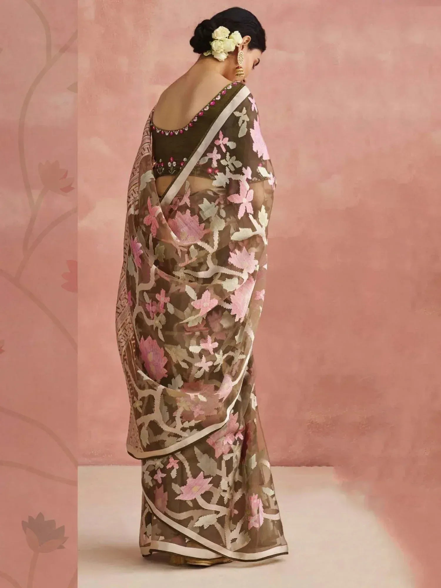 Elegant brown saree with pink floral embroidery, perfect for Indian ethnic wear occasions.