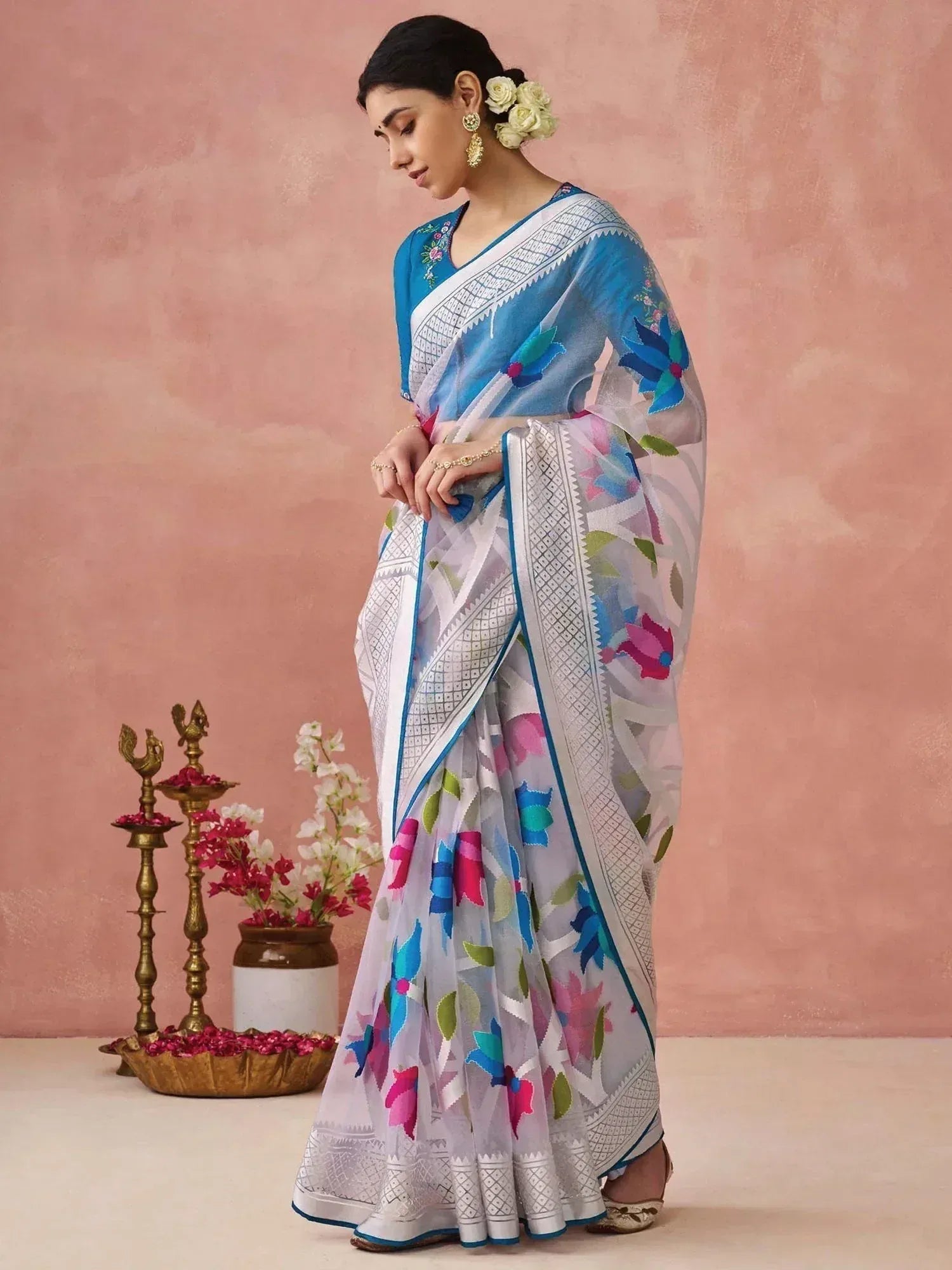 Woman in blue and white floral printed saree with embroidered blouse, perfect for Indian ethnic occasions