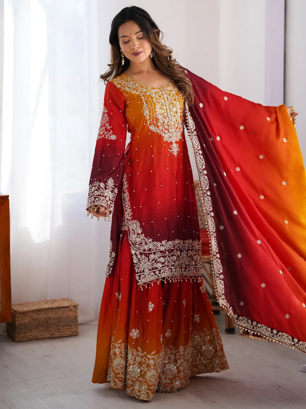 Elegant red and gold embroidered salwar kameez with matching dupatta, perfect for Indian ethnic occasions.