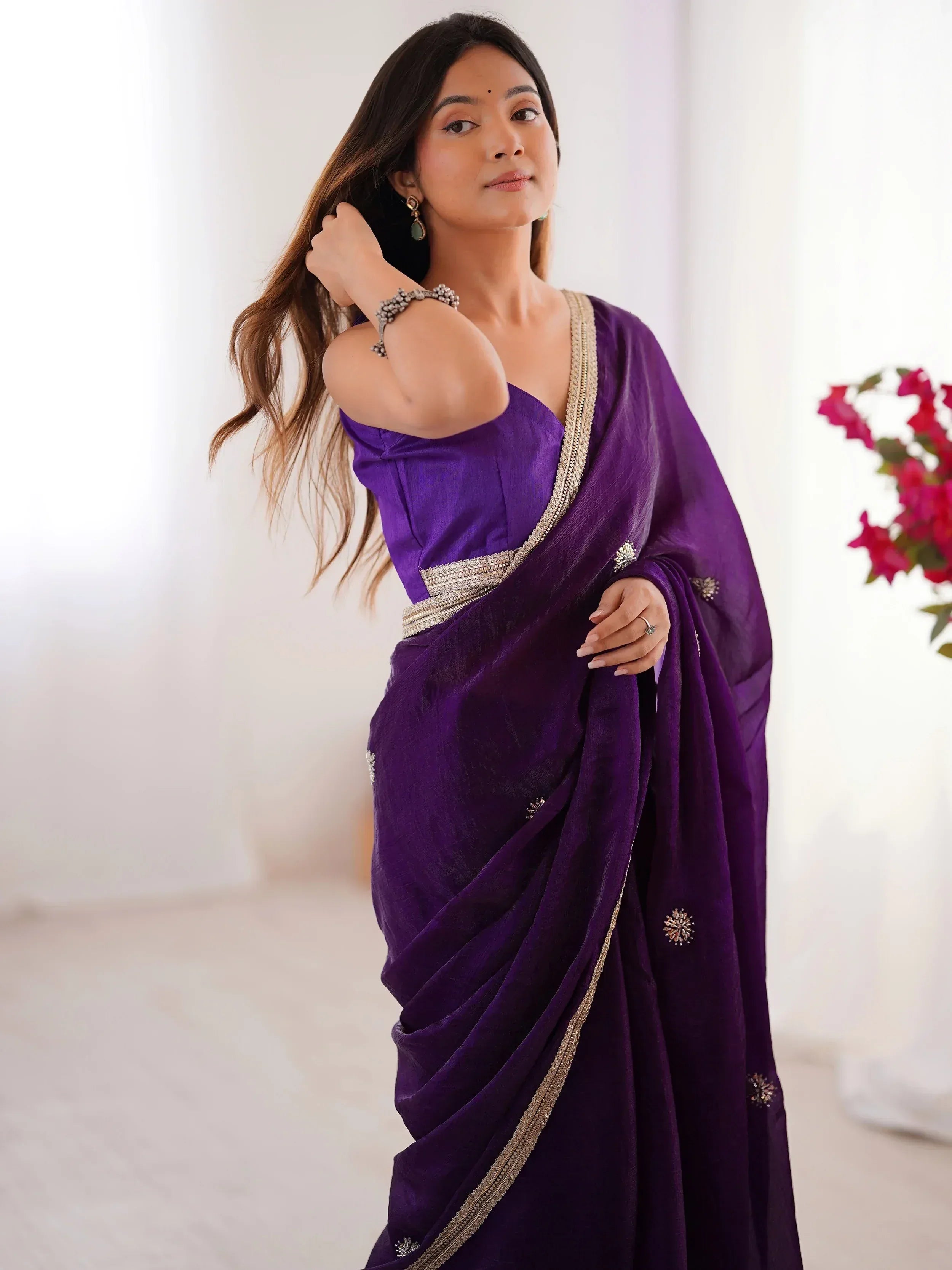 Elegant purple saree with gold embroidery, perfect for Indian ethnic wear and festive occasions.
