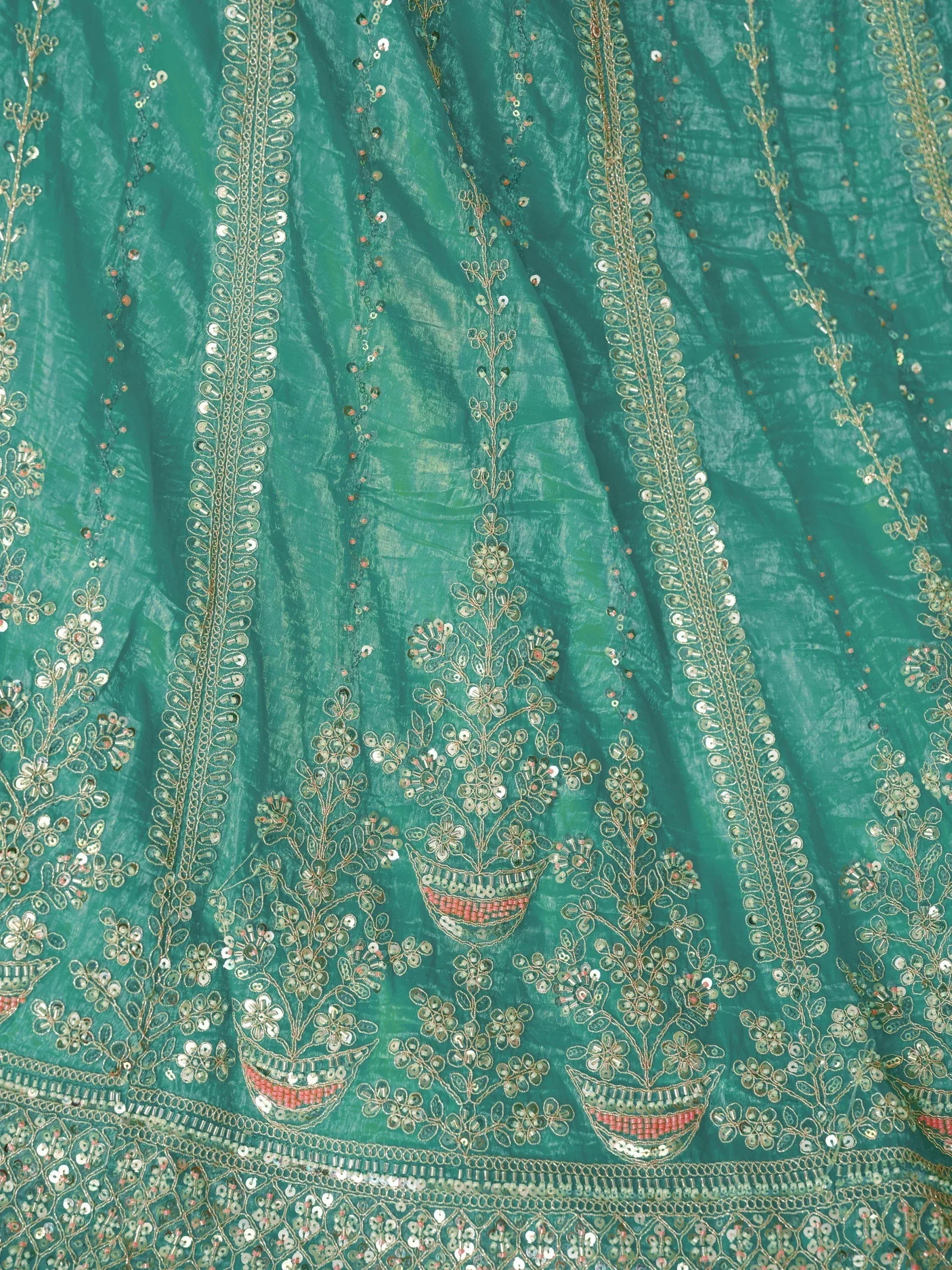 Teal ethnic gown with gold embroidery and mirror work, perfect for Indian festive wear