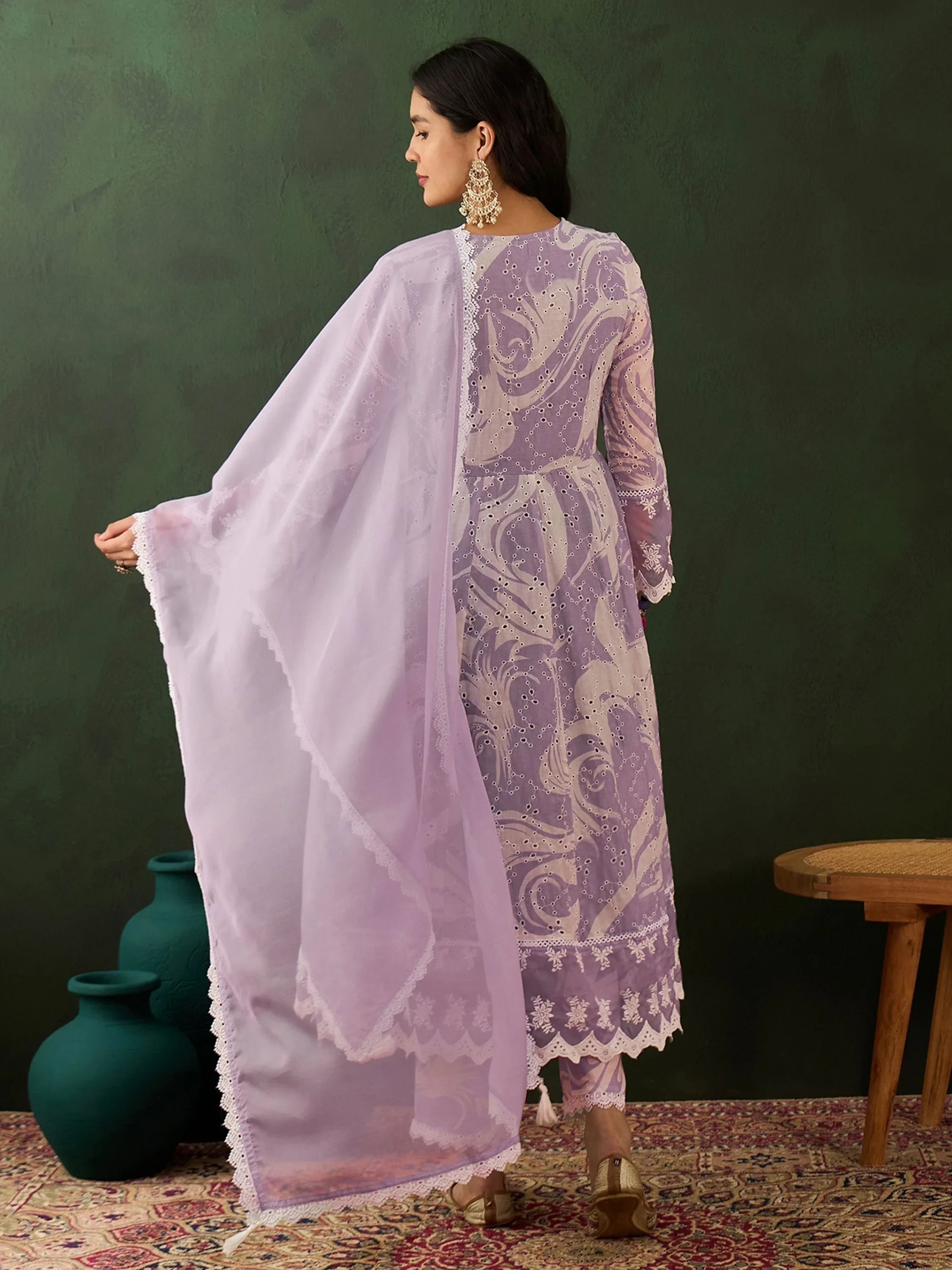Woman in lilac embroidered salwar kameez with dupatta, traditional ethnic wear