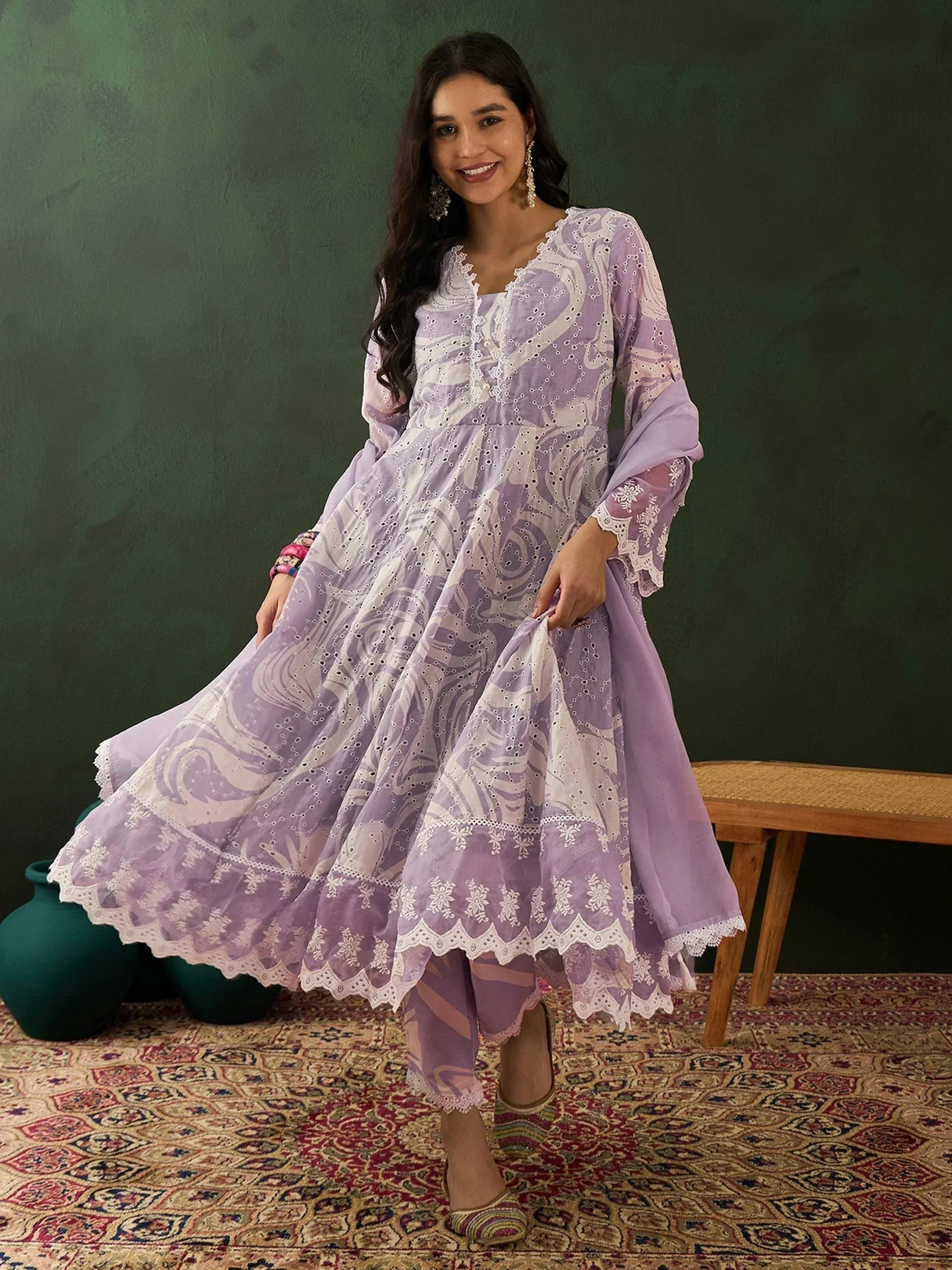 Lavender ethnic gown with white embroidery and lace, paired with matching palazzo pants for festive occasions.