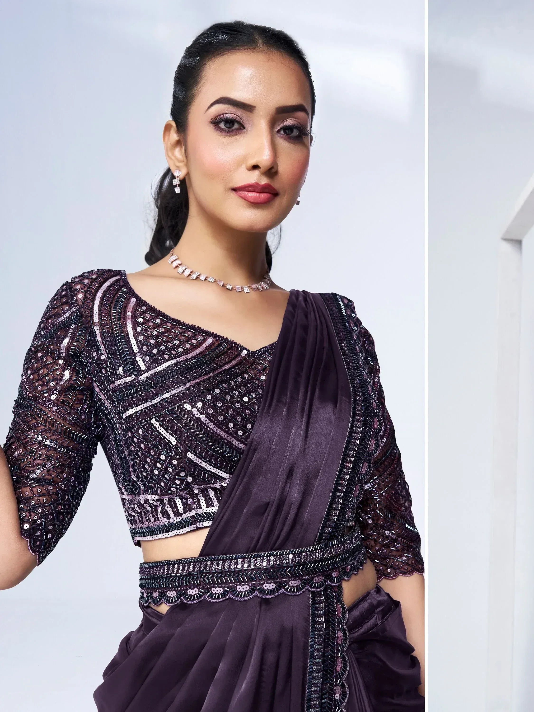 Elegant purple sequin saree with designer blouse, perfect for Indian ethnic wear events.