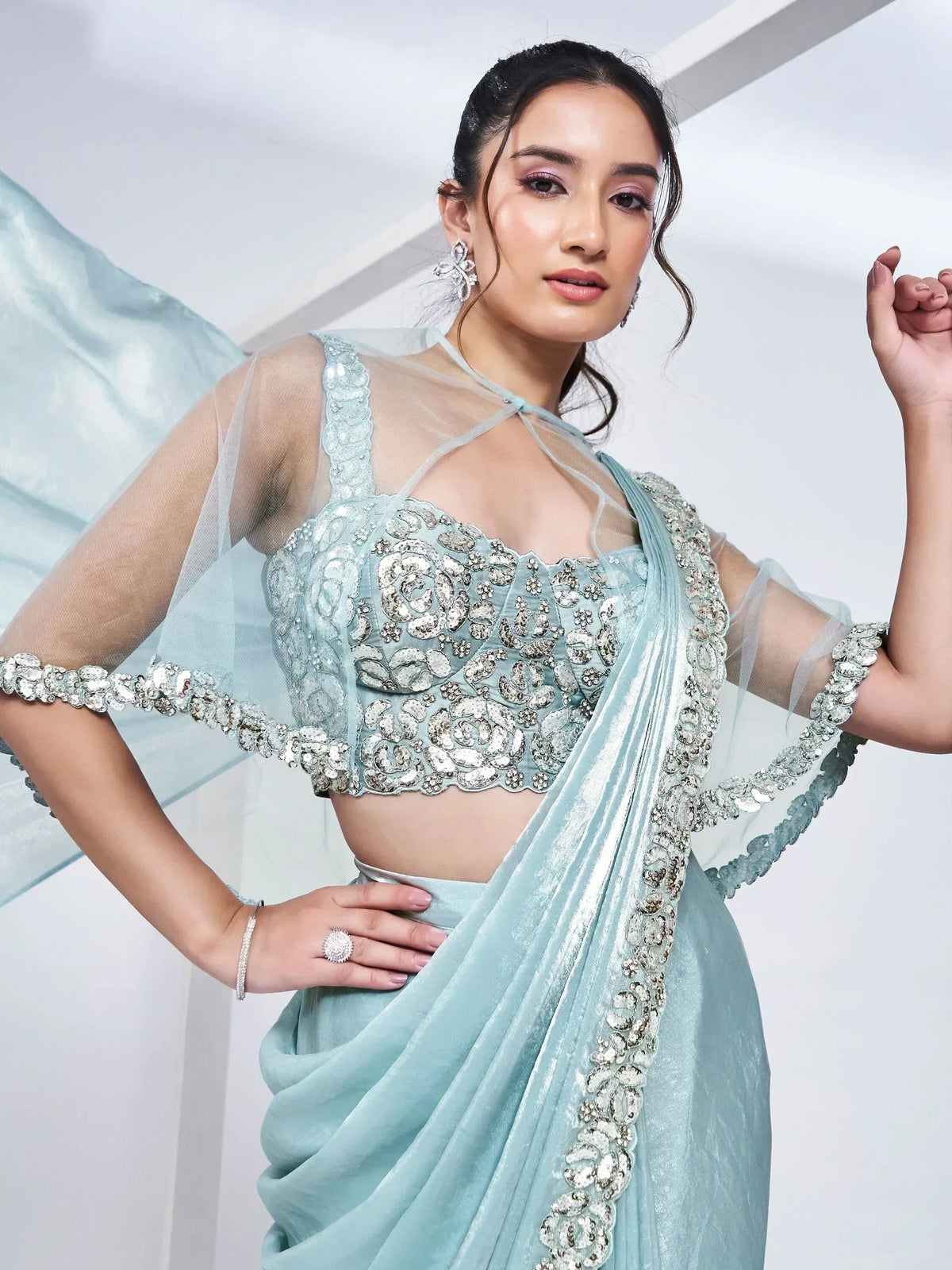 Elegant light blue designer lehenga choli with heavy silver embroidery and sheer dupatta for weddings