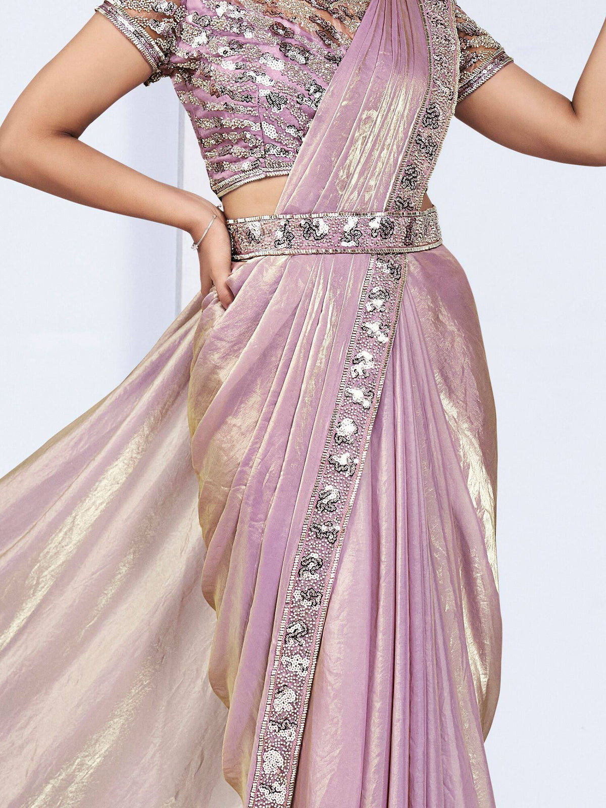 Lavender designer lehenga choli with gold embroidery and sequin work, perfect for Indian ethnic wear occasions.