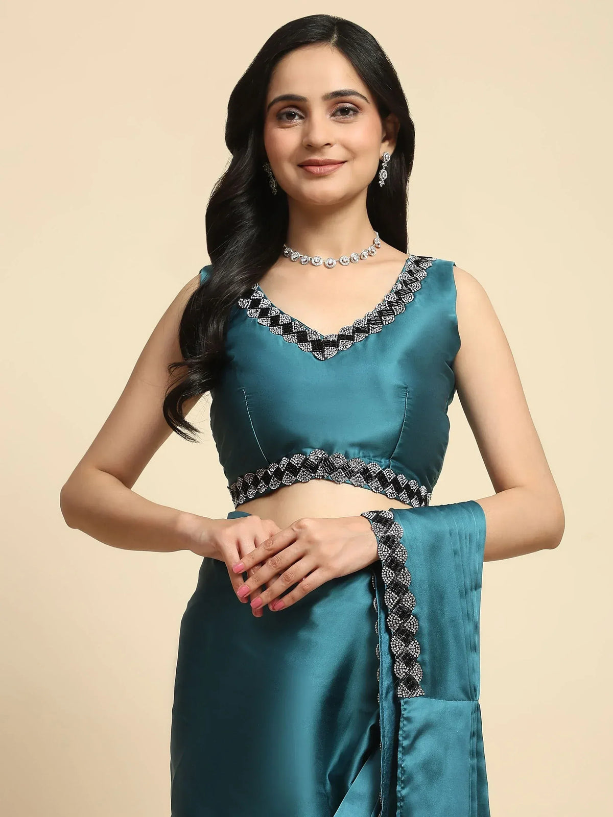 Teal satin lehenga choli with black and silver embroidery, perfect for Indian ethnic wear events