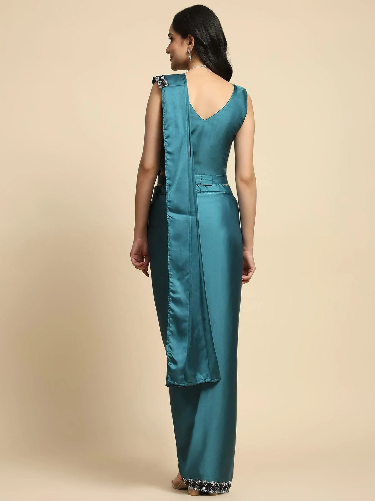 Teal satin ethnic gown with back drape and embellished hem, perfect for Indian occasions