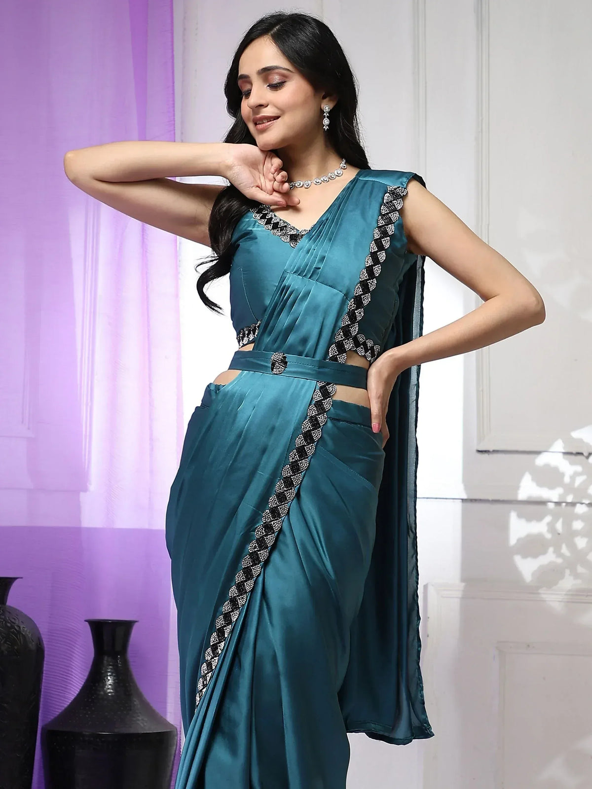 Teal satin saree with black and silver embroidery, perfect for Indian ethnic wear occasions