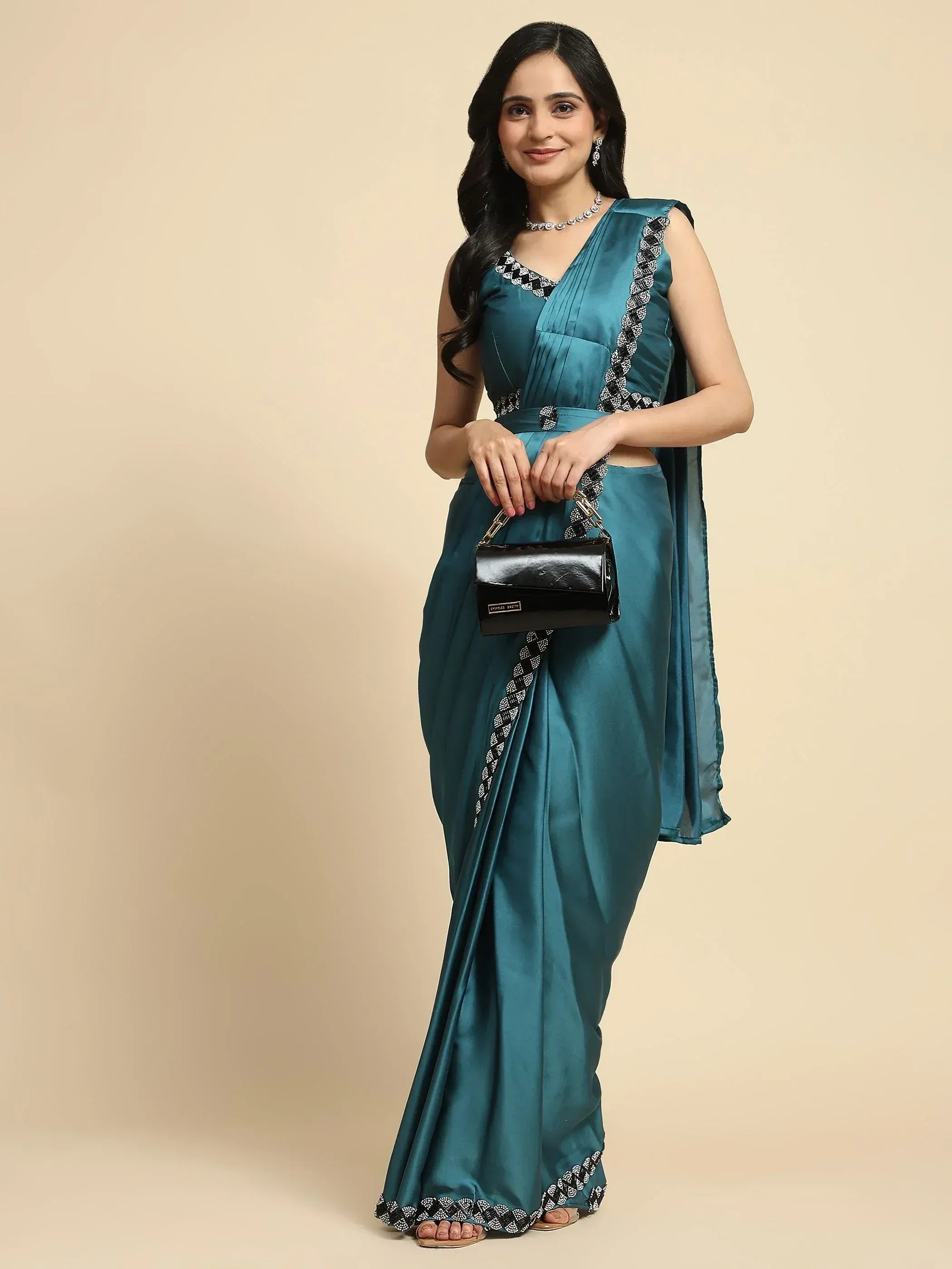 Teal satin saree with black and white embroidery, stylish ethnic wear for women