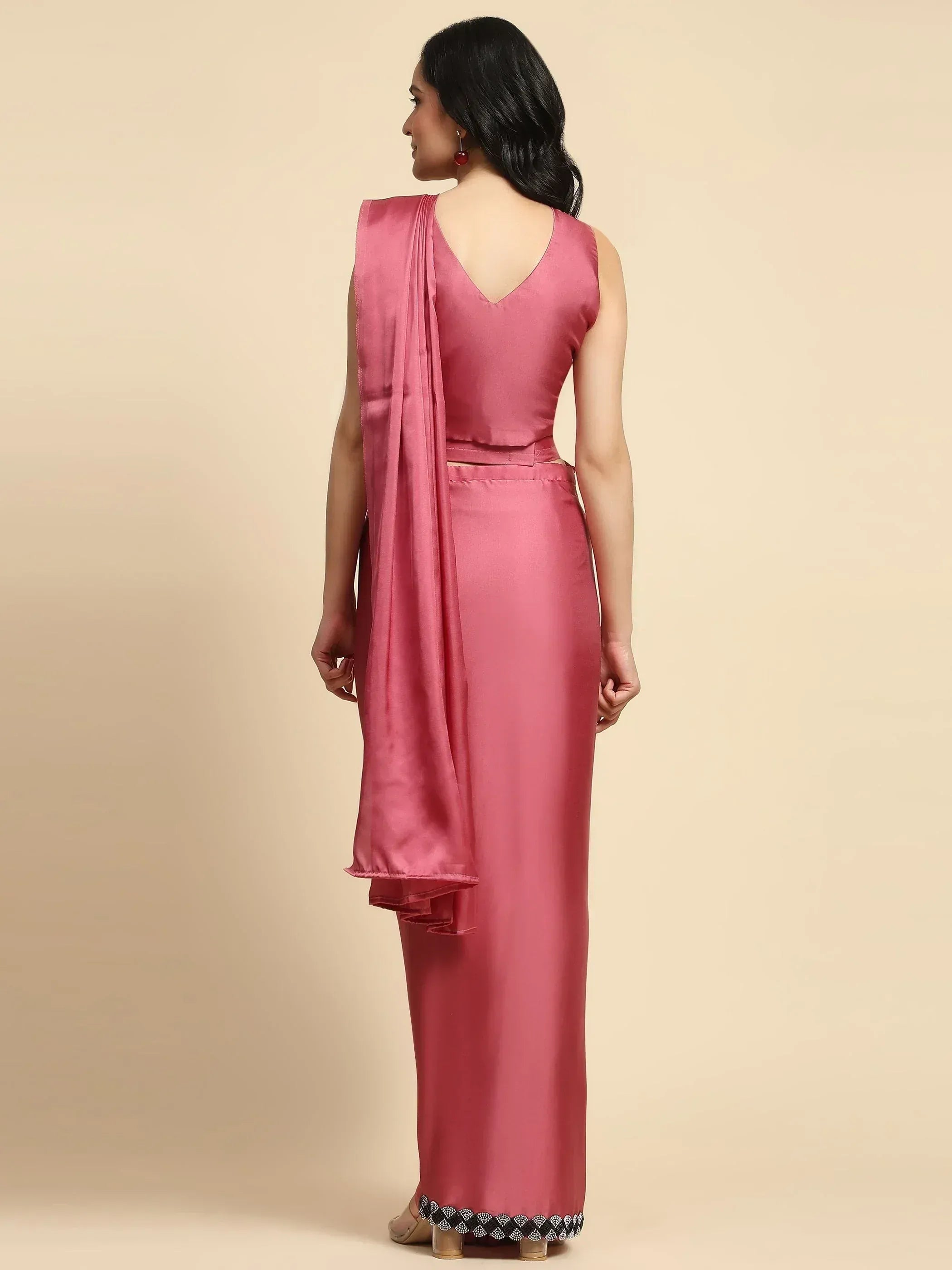 Pink satin ethnic gown with V-back and embellished hem, paired with matching drape for women