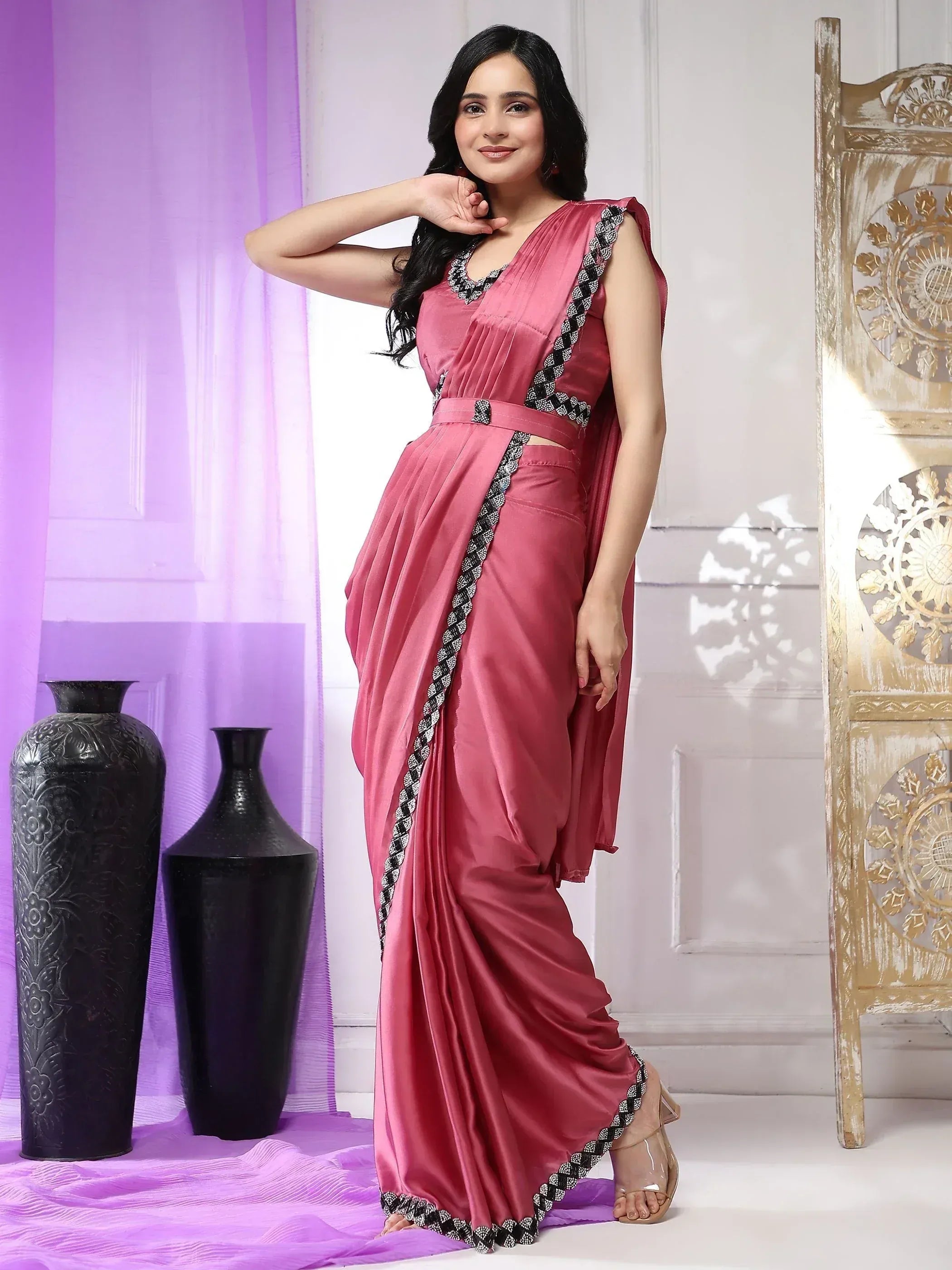 Pink satin saree with black and white embroidered border, stylish ethnic wear for women