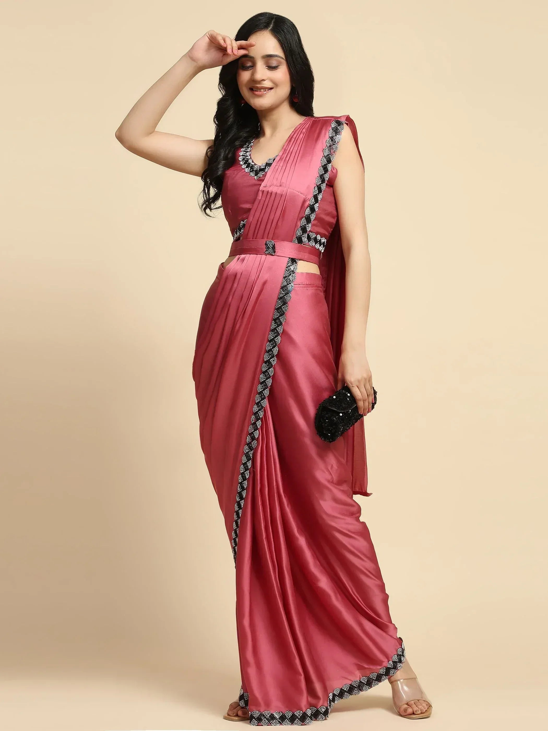 Pink satin saree gown with black white embroidery, perfect for Indian ethnic wear events