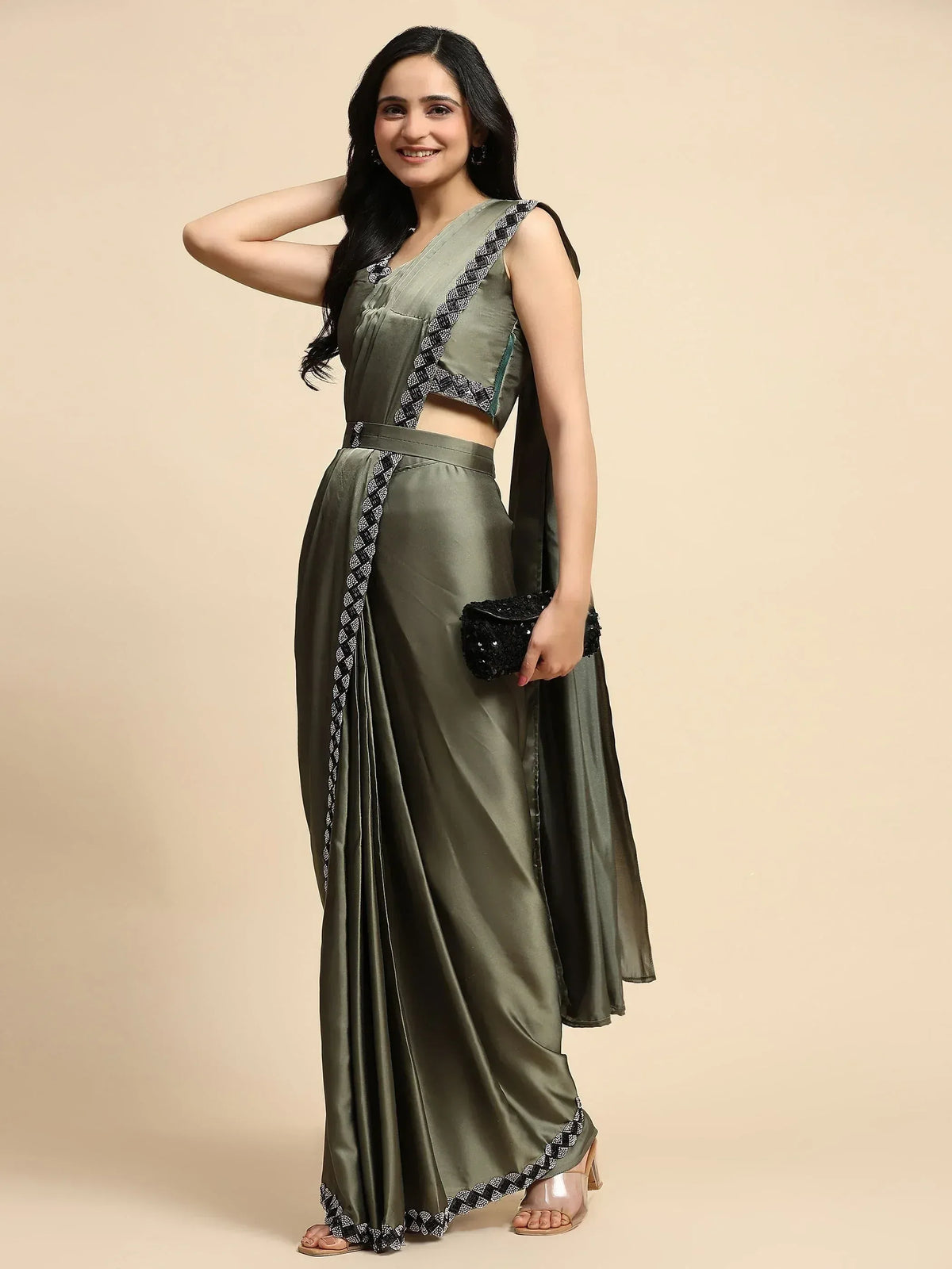 Olive green ethnic saree gown with black and white border, perfect for Indian occasions