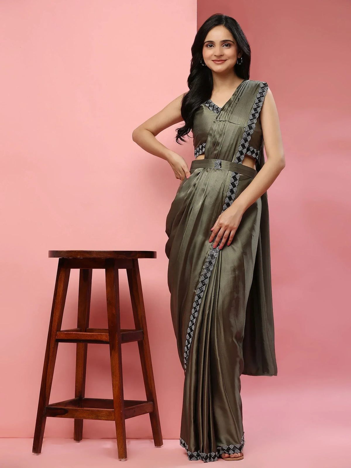 Olive green ethnic saree gown with black white embroidery, perfect for Indian occasions