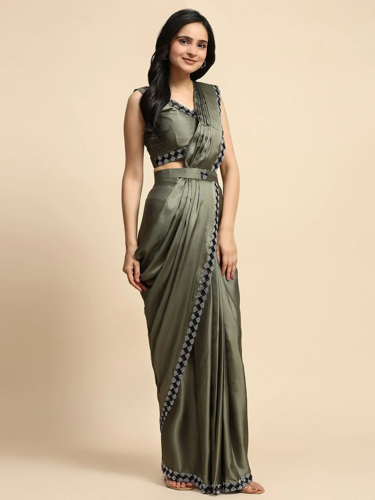 Olive green satin saree with black white geometric border, sleeveless blouse, ethnic wear