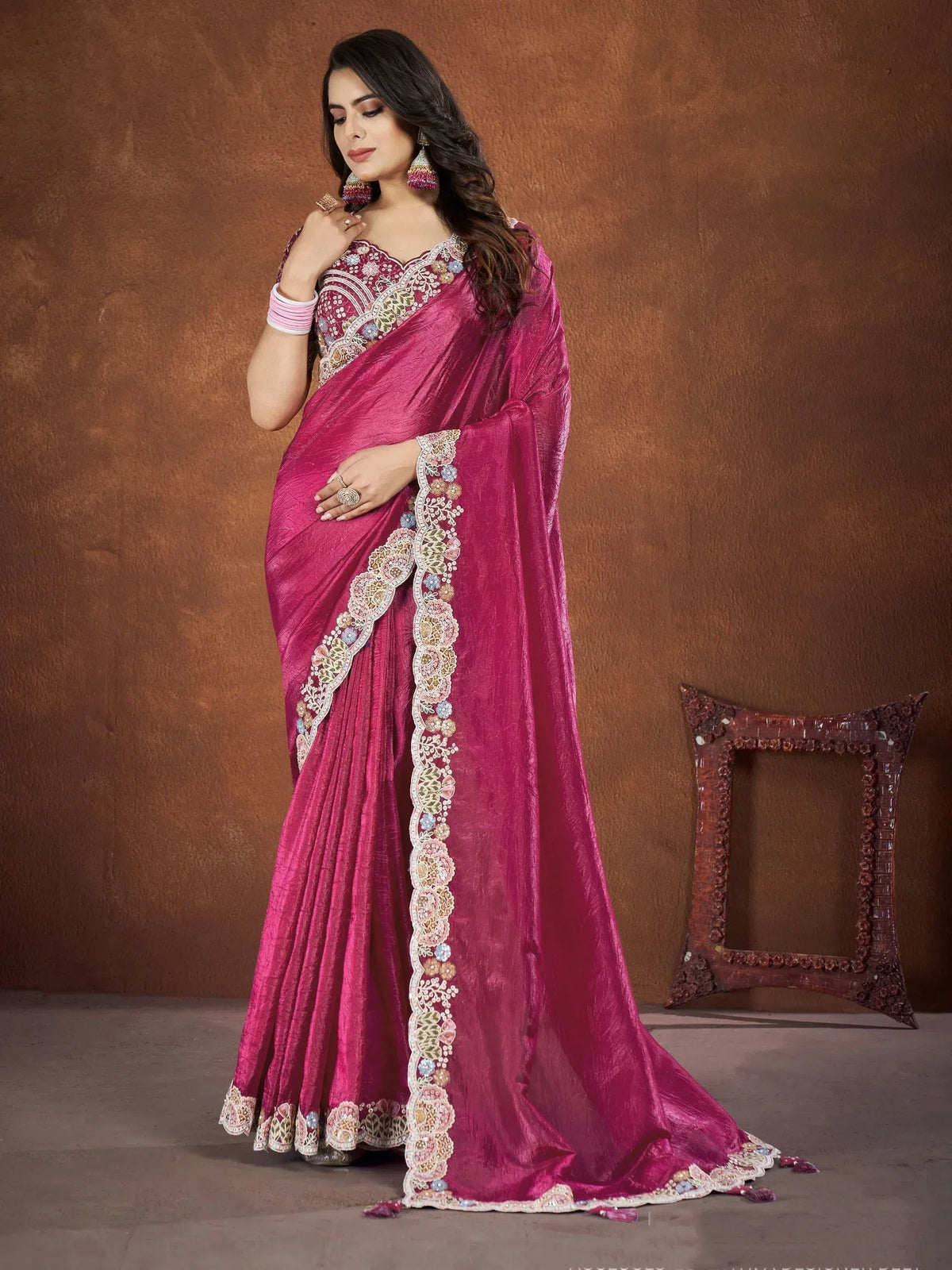 Elegant magenta saree with floral embroidery, perfect for Indian ethnic wear occasions