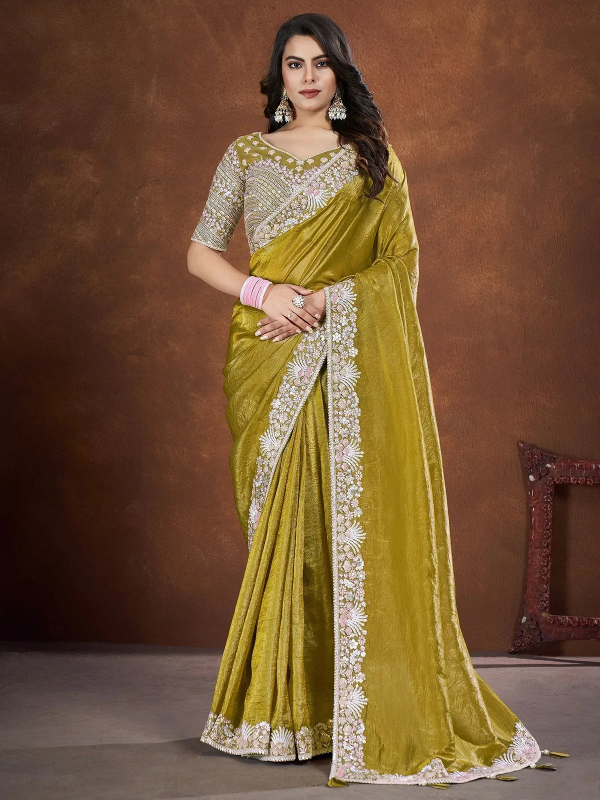 Olive green embroidered saree with floral border, perfect for Indian ethnic occasions and weddings.