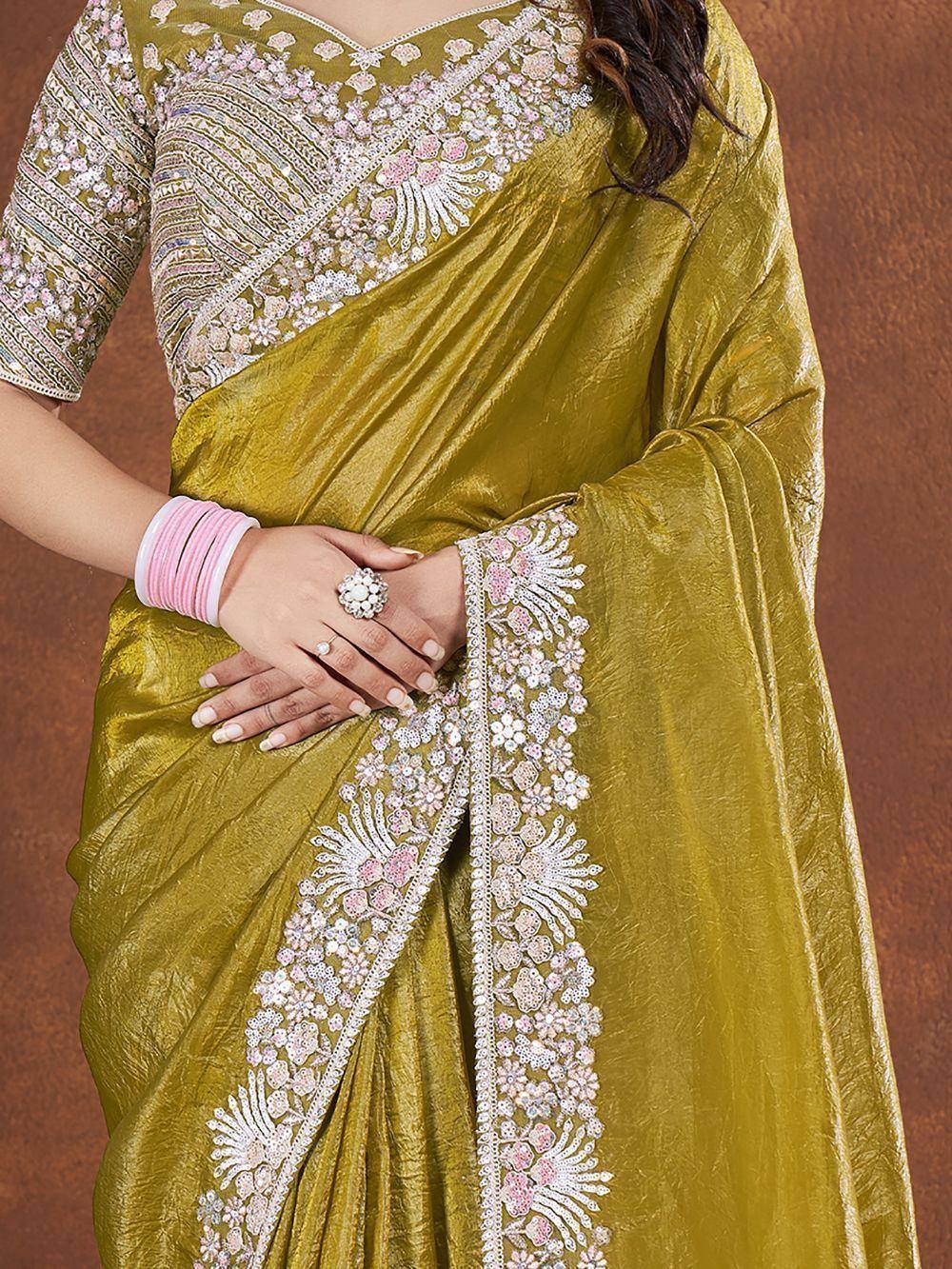 Olive green designer saree with pink and white floral embroidery, perfect for ethnic occasions