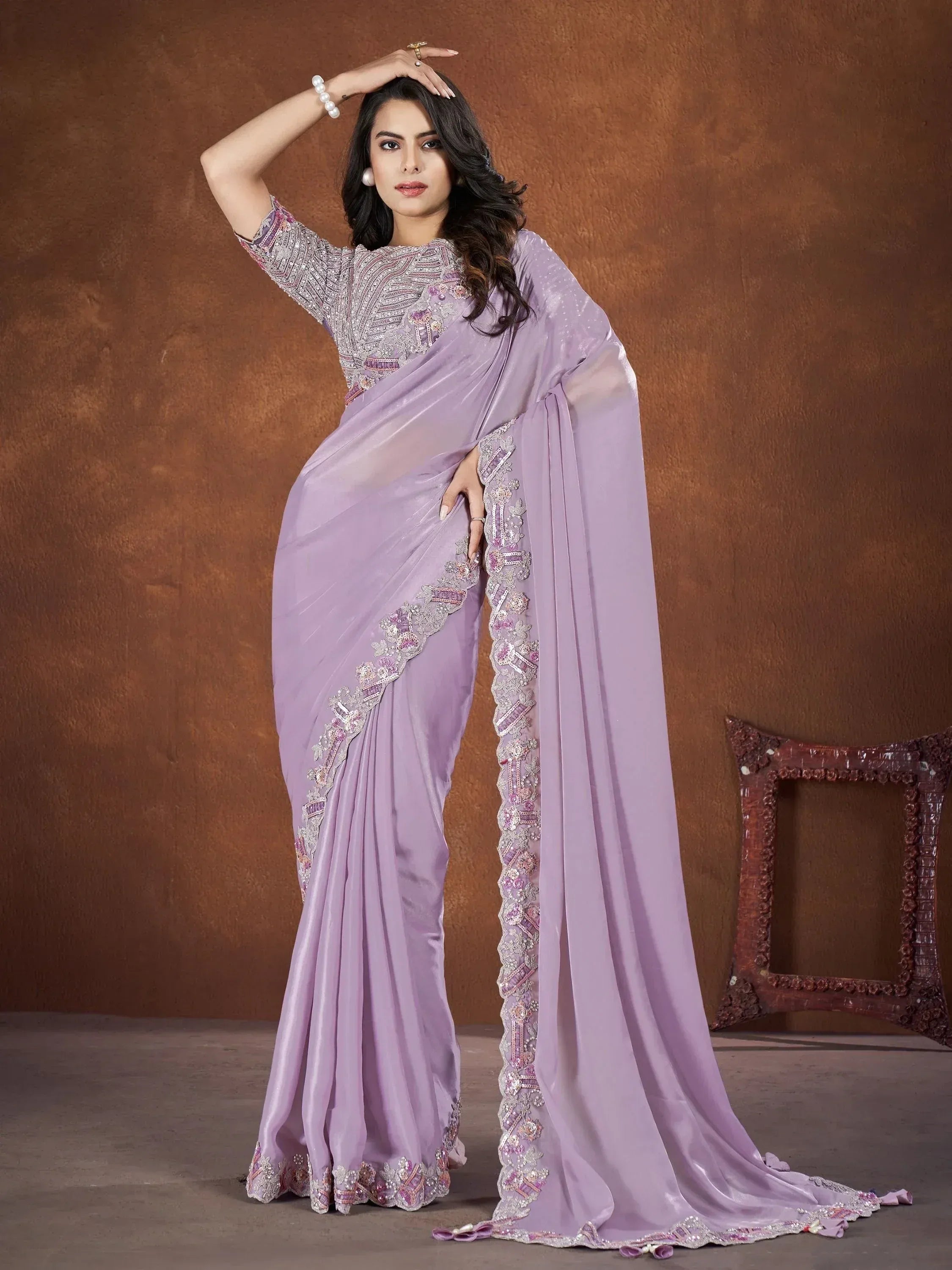 Lavender designer saree with intricate embroidery and embellished border, perfect for ethnic occasions