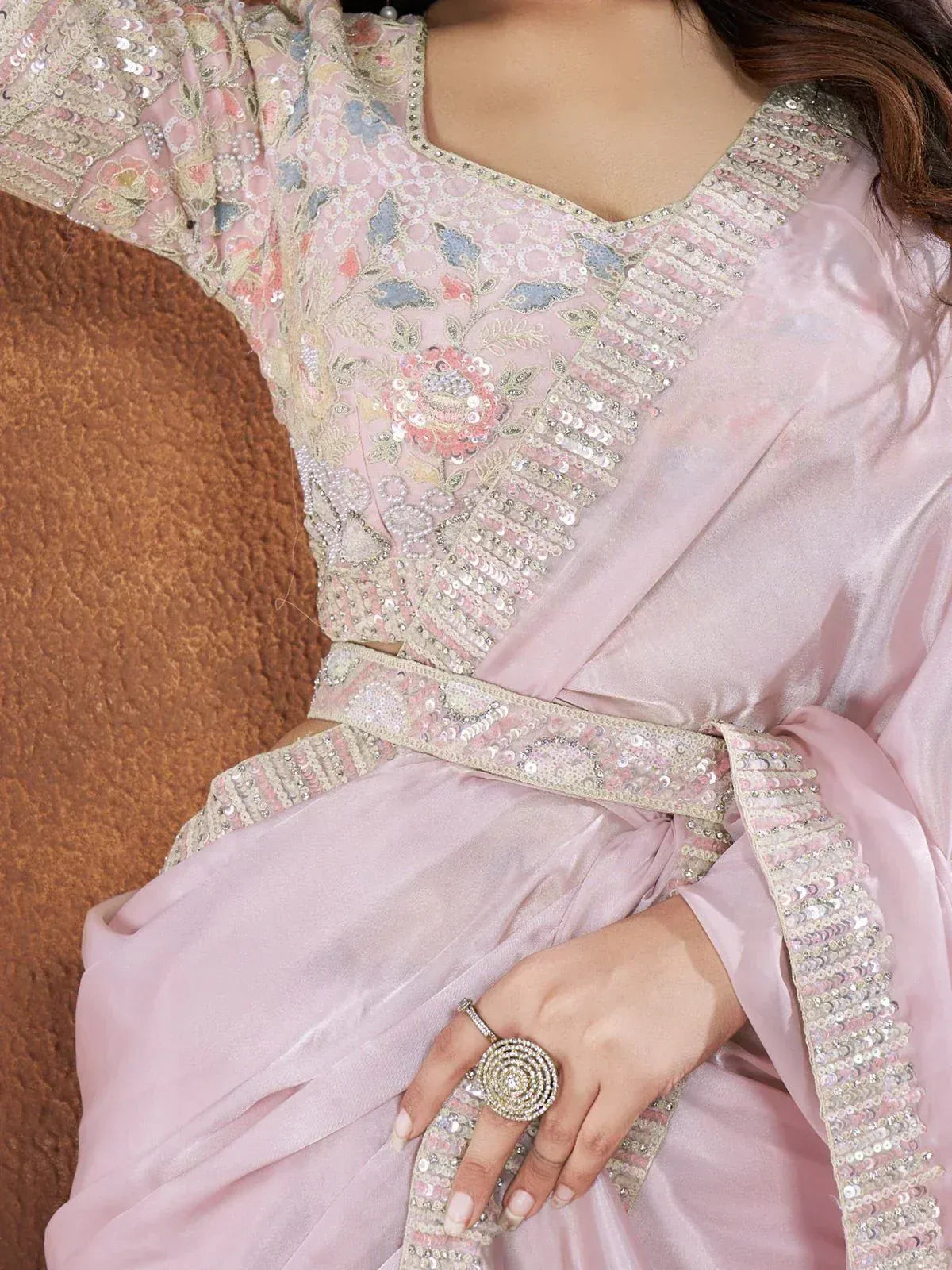 Pink embroidered ethnic gown with sequin detailing and floral motifs, perfect for Indian festive wear.
