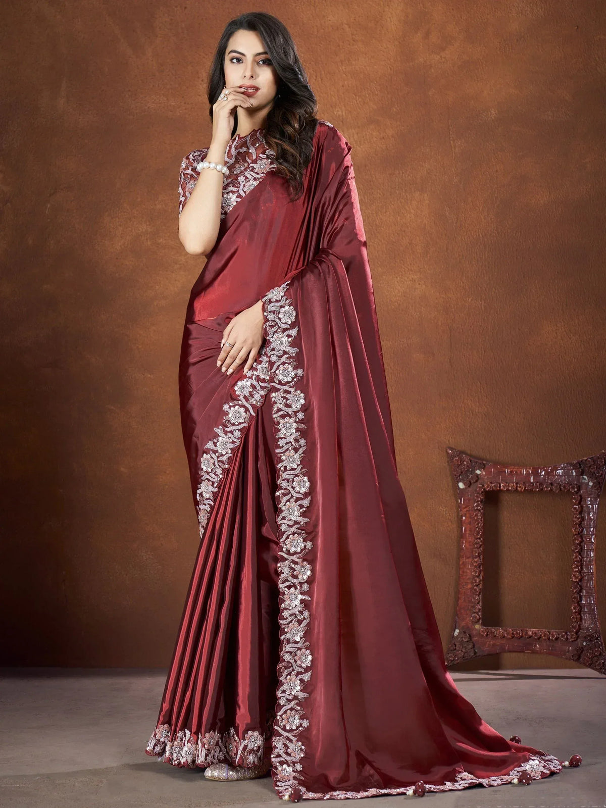 Elegant maroon saree with floral embroidery, perfect for Indian ethnic wear occasions