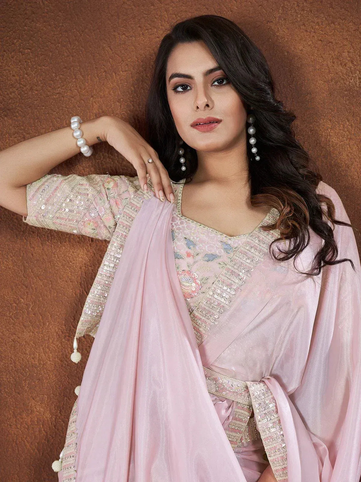 Pink embroidered designer salwar kameez with sequins and pearl jewelry for ethnic wear