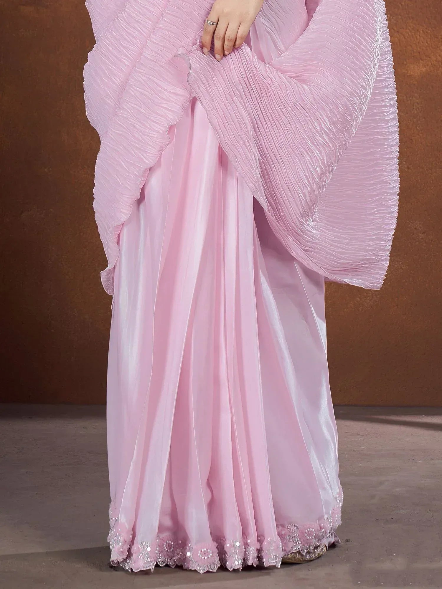 Pink pleated ethnic gown with floral lace hem, perfect for Indian occasions