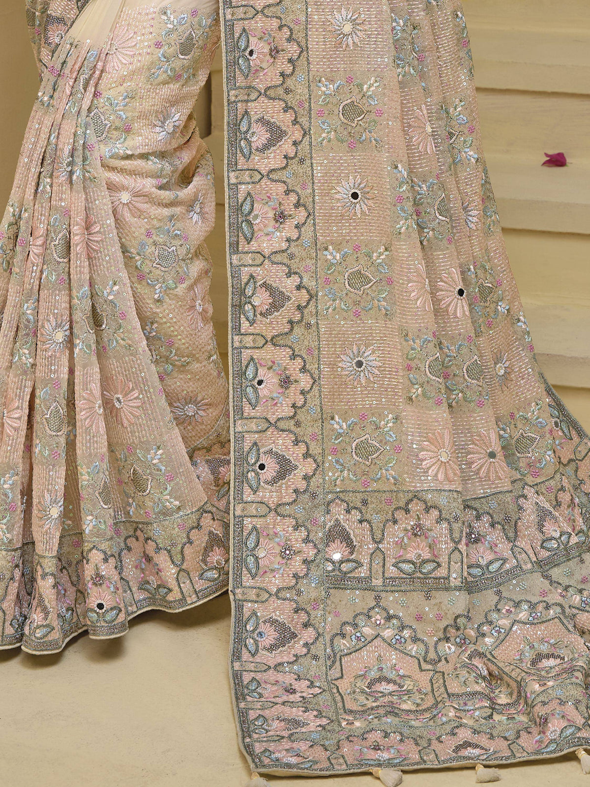 Elegant beige lehenga choli with floral embroidery and sequin work, perfect for Indian ethnic occasions.