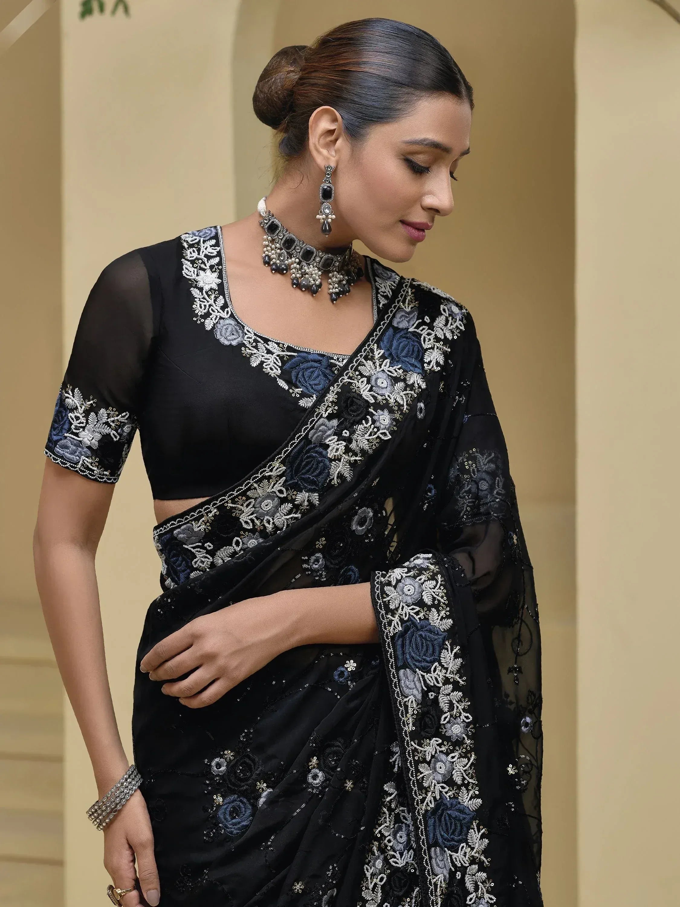 Black embroidered saree with floral detailing, perfect for Indian ethnic wear and designer occasions.