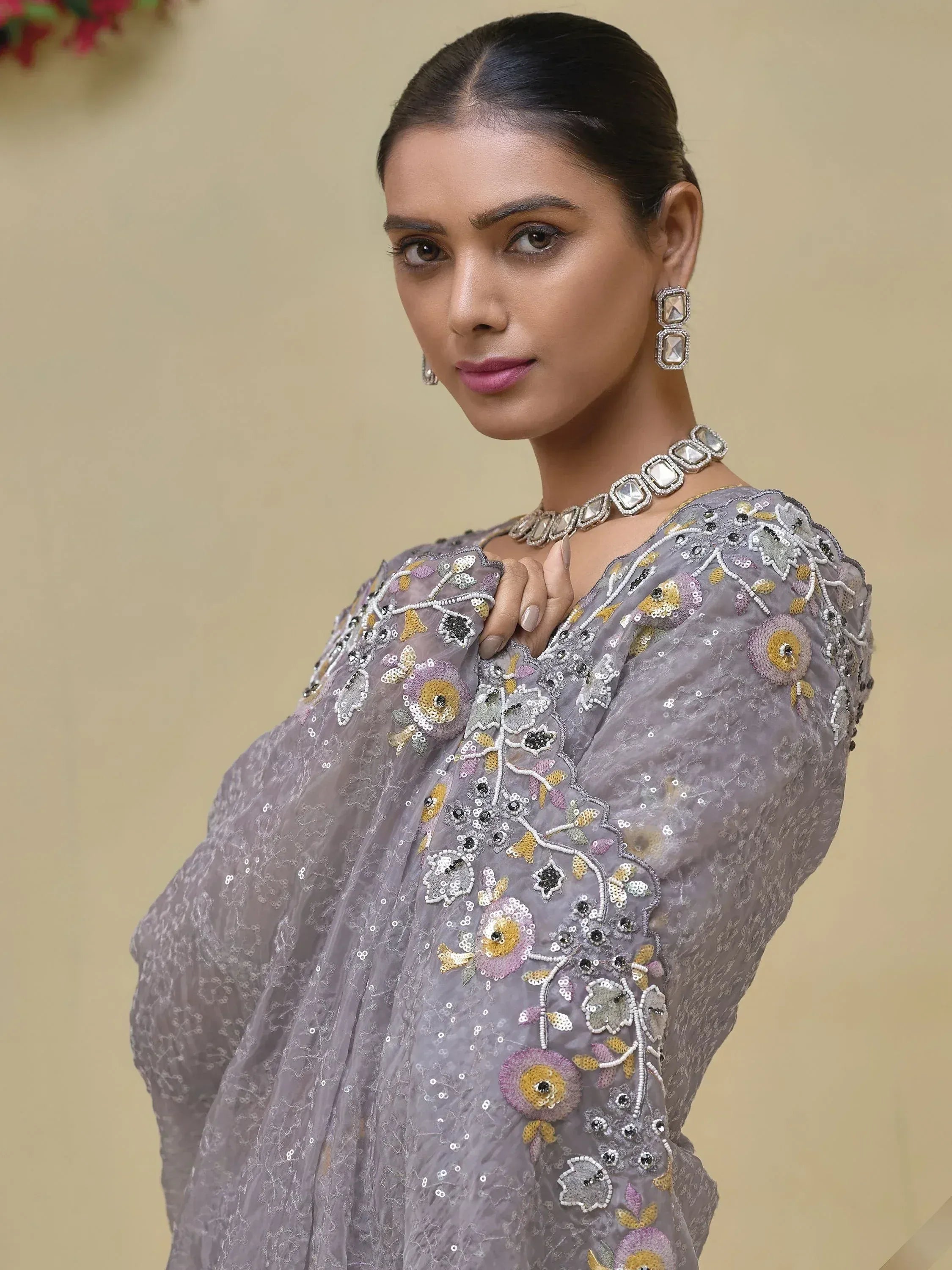 Elegant grey floral embroidered ethnic gown with sequins and statement jewelry