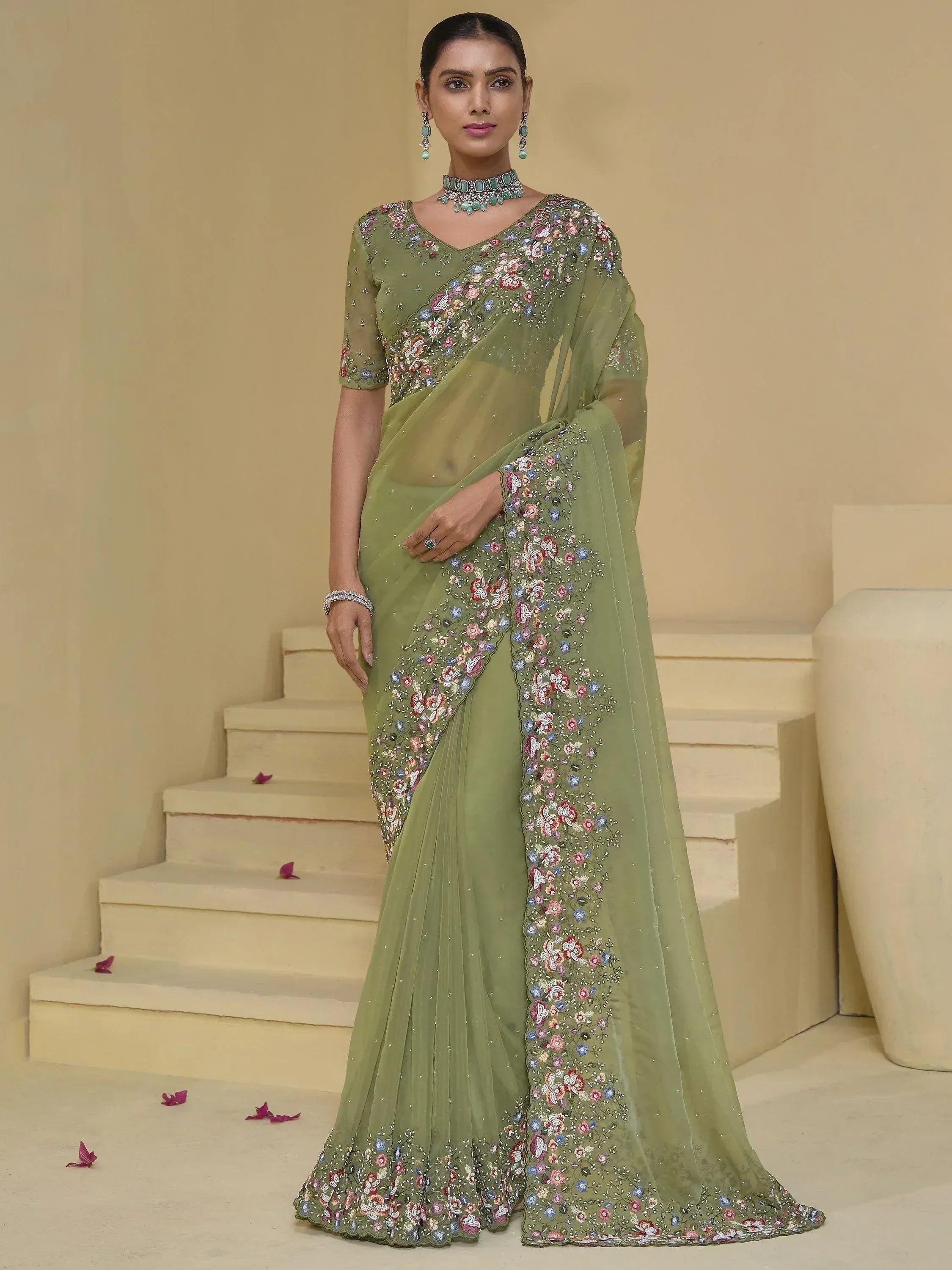 Olive green embroidered saree with floral motifs, perfect for Indian ethnic occasions and weddings.