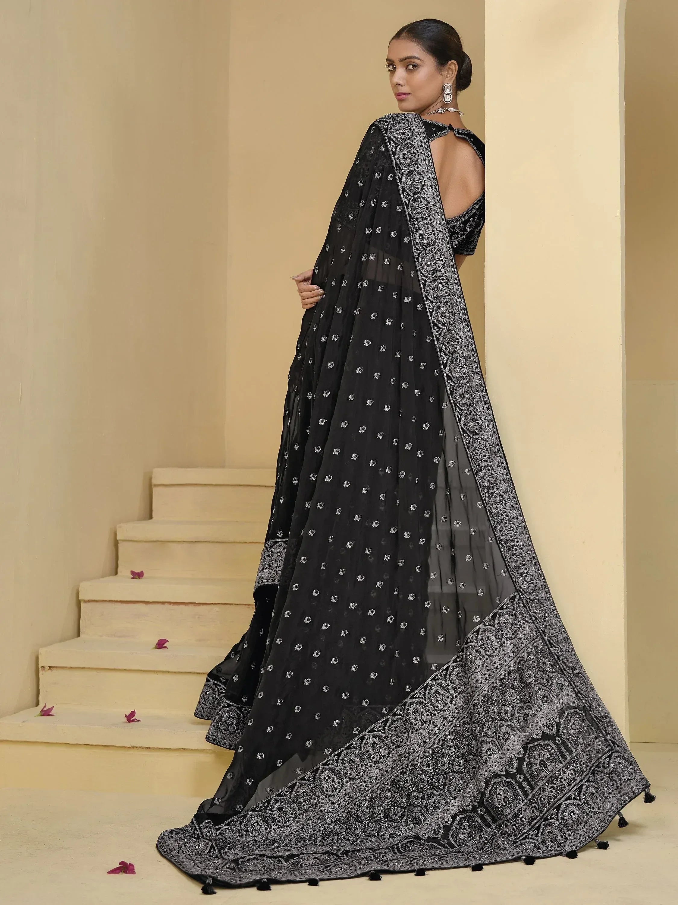 Black embroidered lehenga choli with silver detailing, perfect for Indian ethnic wear events