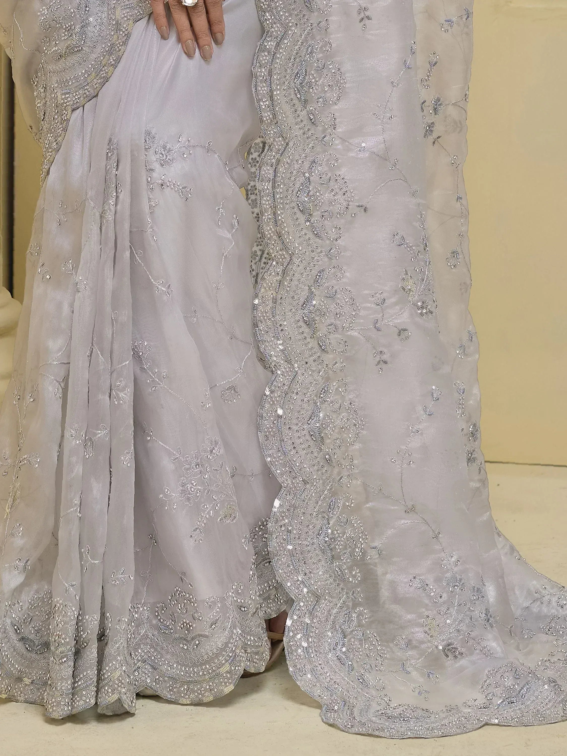 Elegant silver grey lehenga choli with intricate floral embroidery and sequin detailing for Indian ethnic wear.