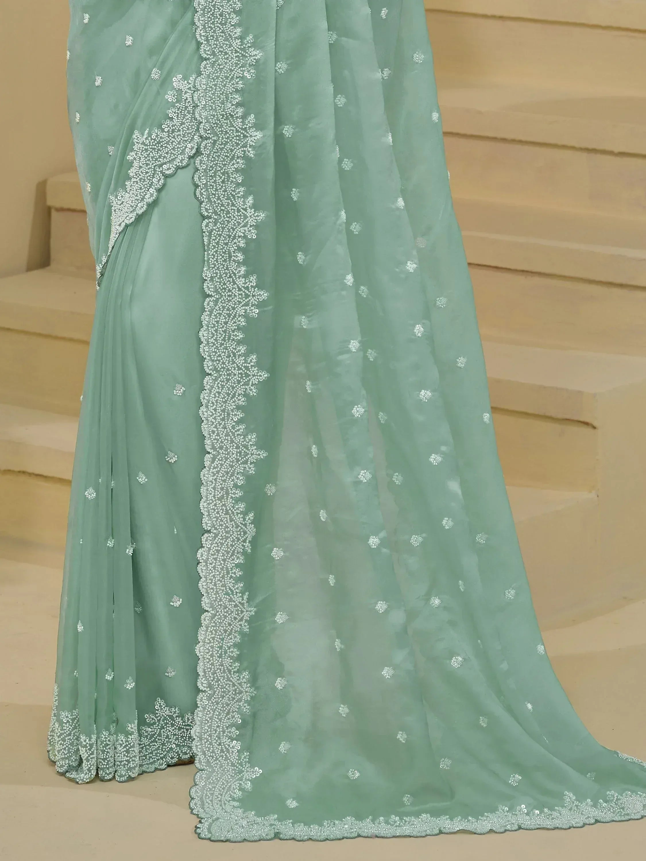 Mint green saree with silver floral embroidery and sequin border, elegant Indian ethnic wear