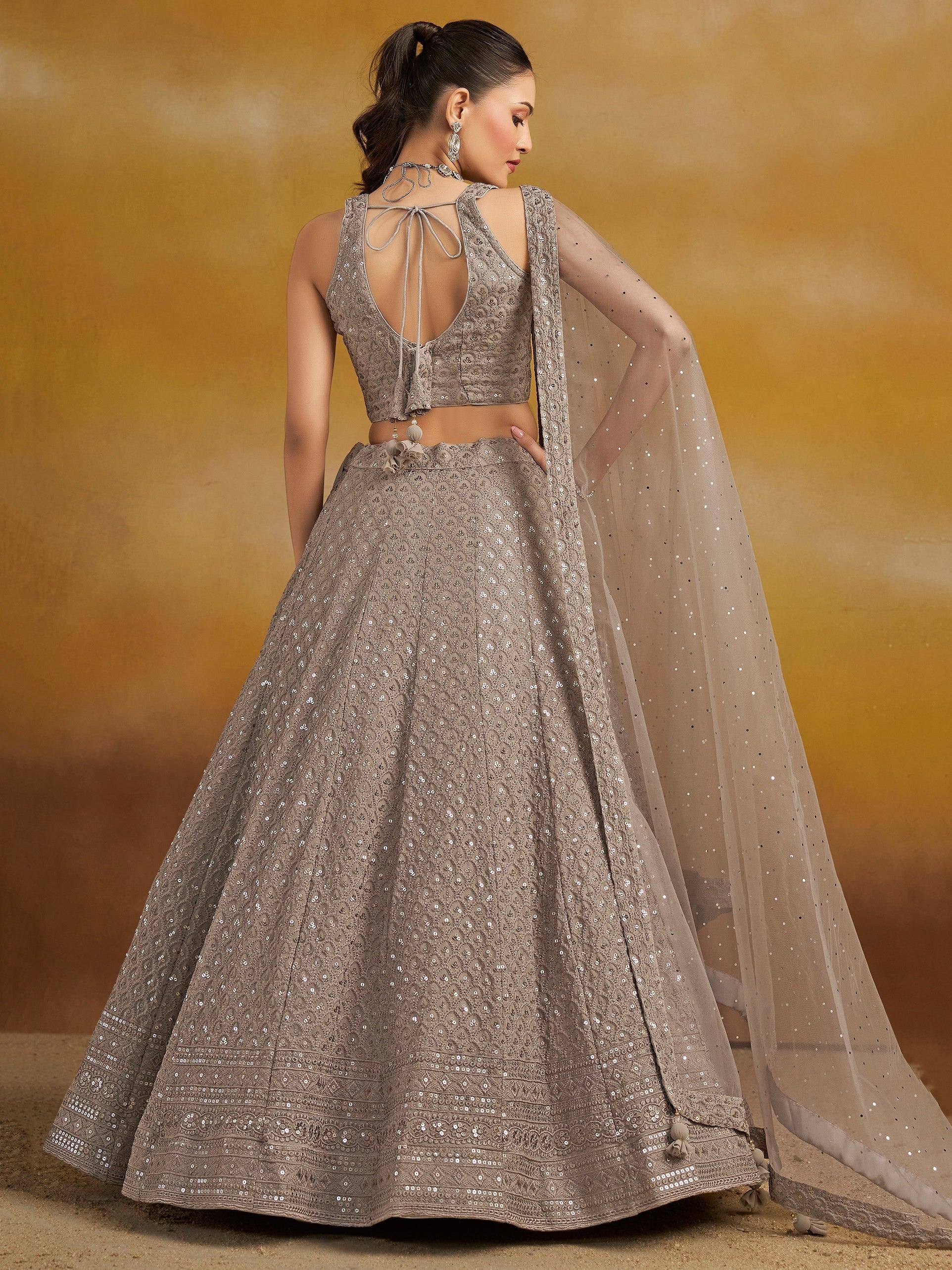 Elegant grey designer lehenga choli with sequin work, back tie blouse, and sheer dupatta for Indian ethnic wear.