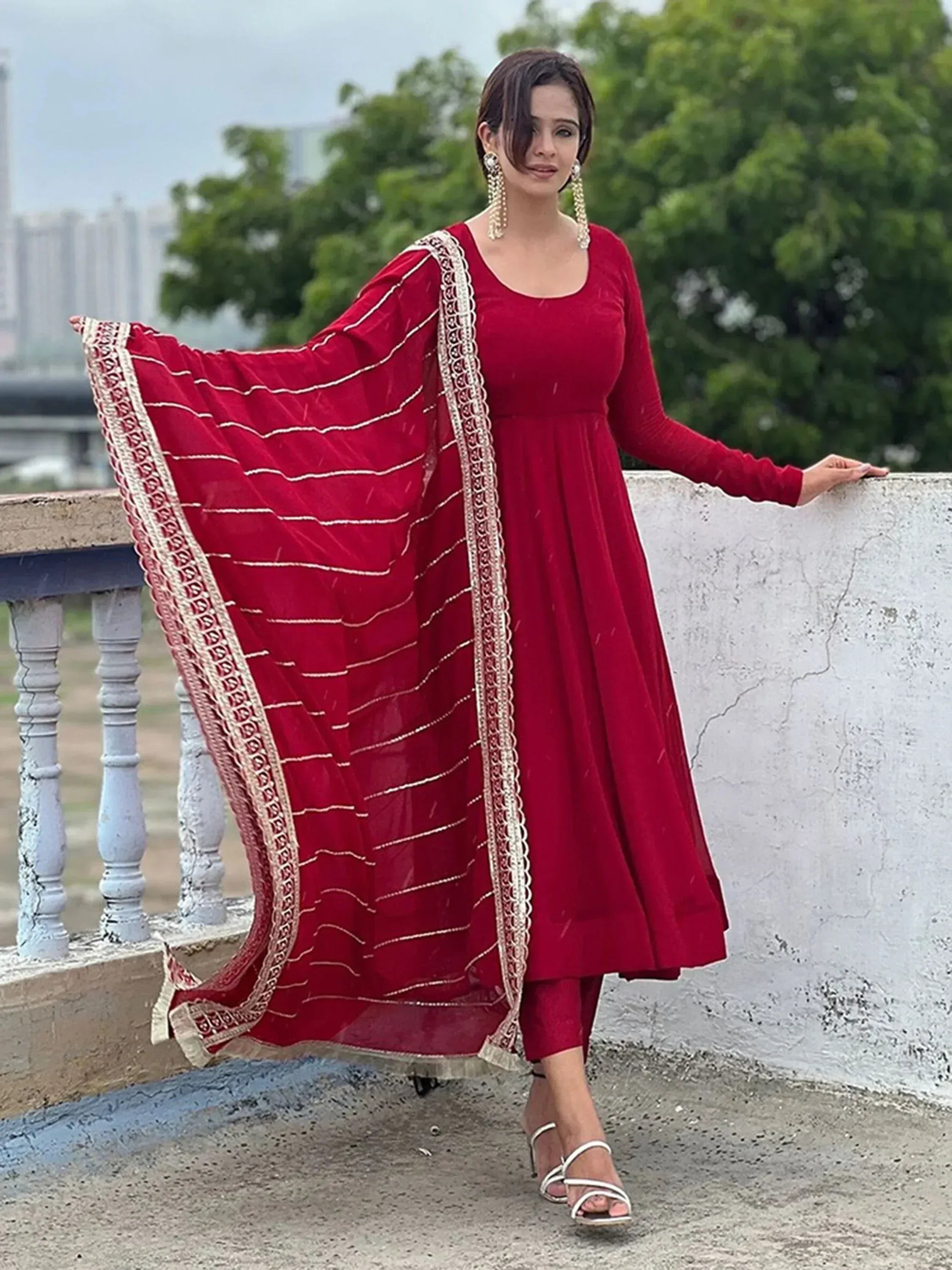 Red velvet ethnic gown with embroidered dupatta, perfect for Indian occasions and festive wear