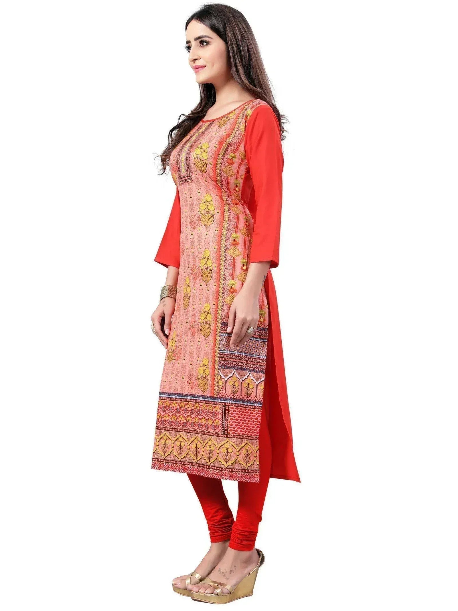 Woman in printed pink and red ethnic kurti with matching pants, ideal for Indian festive wear