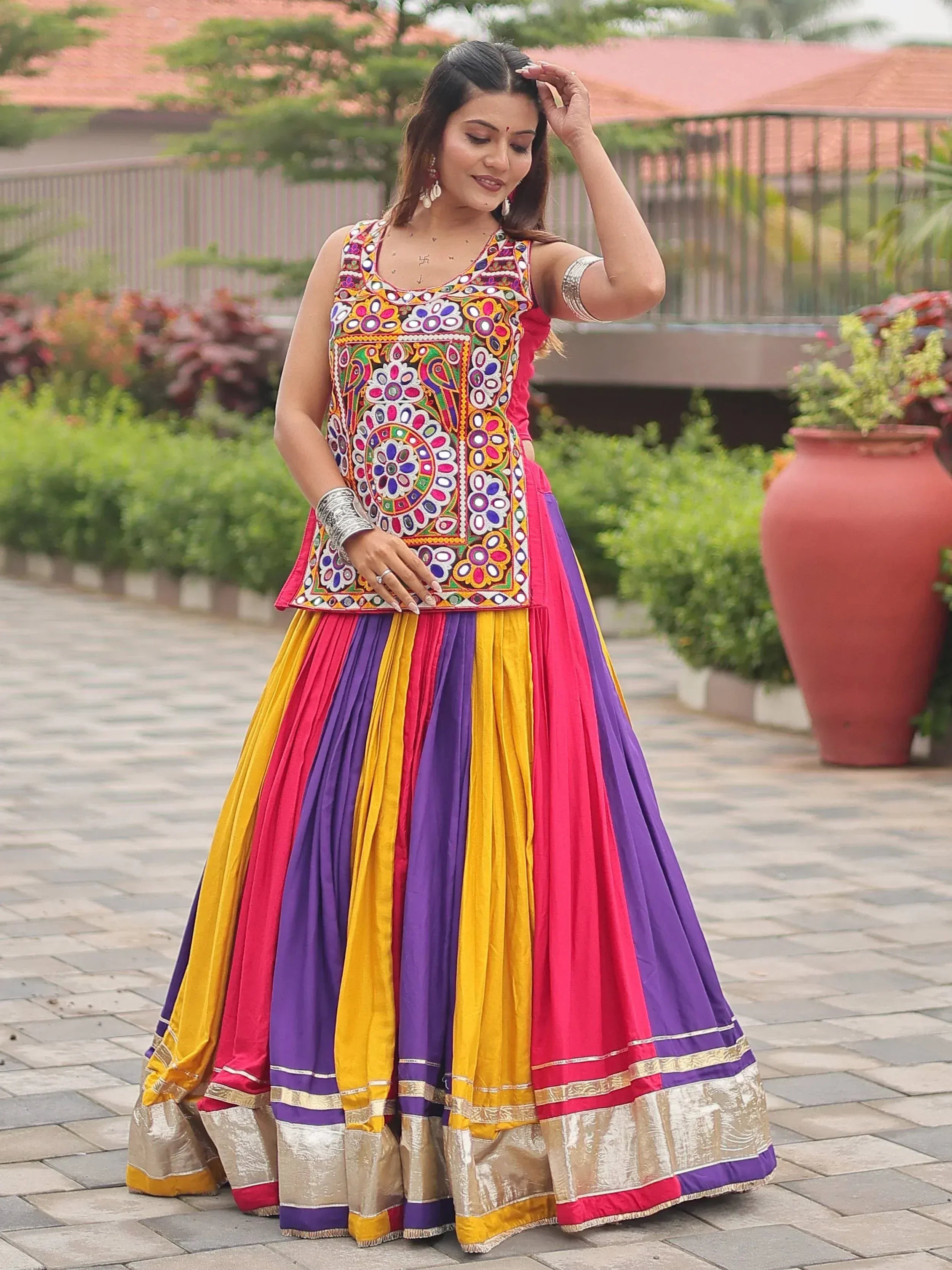 Colorful embroidered lehenga choli with vibrant stripes, perfect for Indian ethnic wear occasions